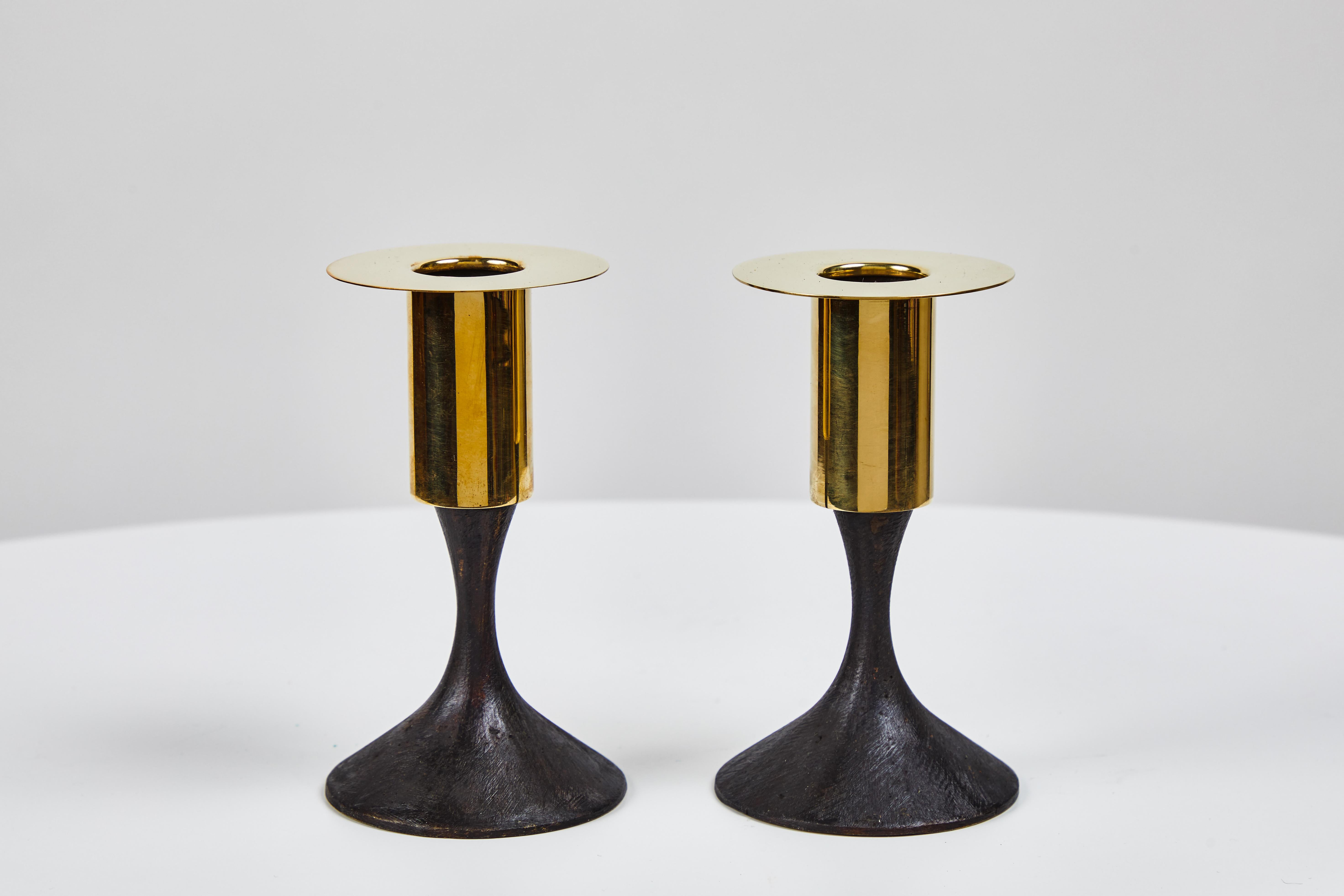 Carl Auböck brass #7234 candleholder. Designed in the 1950s, this versatile and Minimalist Viennese candleholder is executed in polished and patinated brass by Werkstätte Carl Auböck, Austria. 

Price is per item. Two in stock ready to ship.