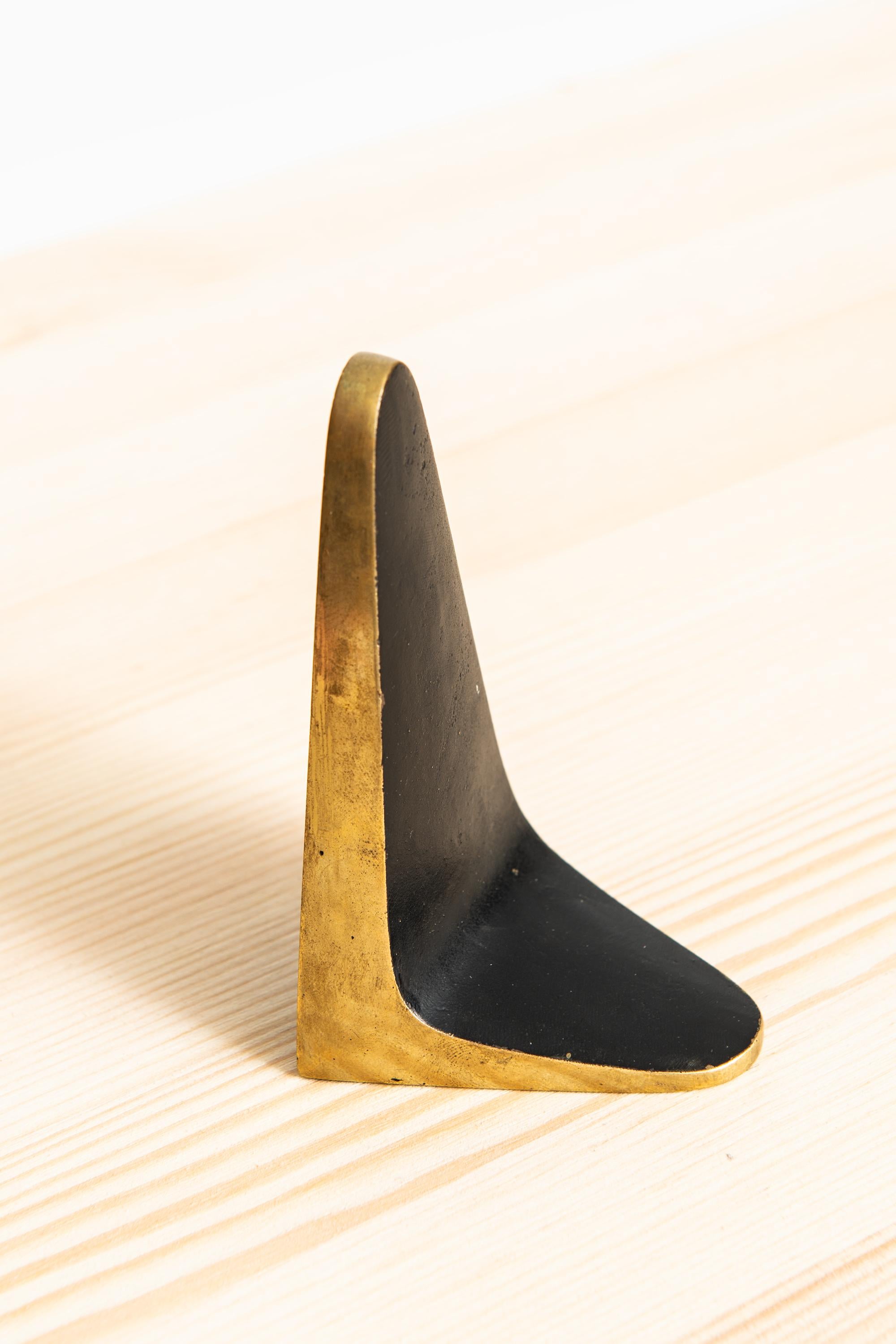 Rare bookend in brass attributed to Carl Auböck. Produced and stamped by Illum Bolighus in Denmark.