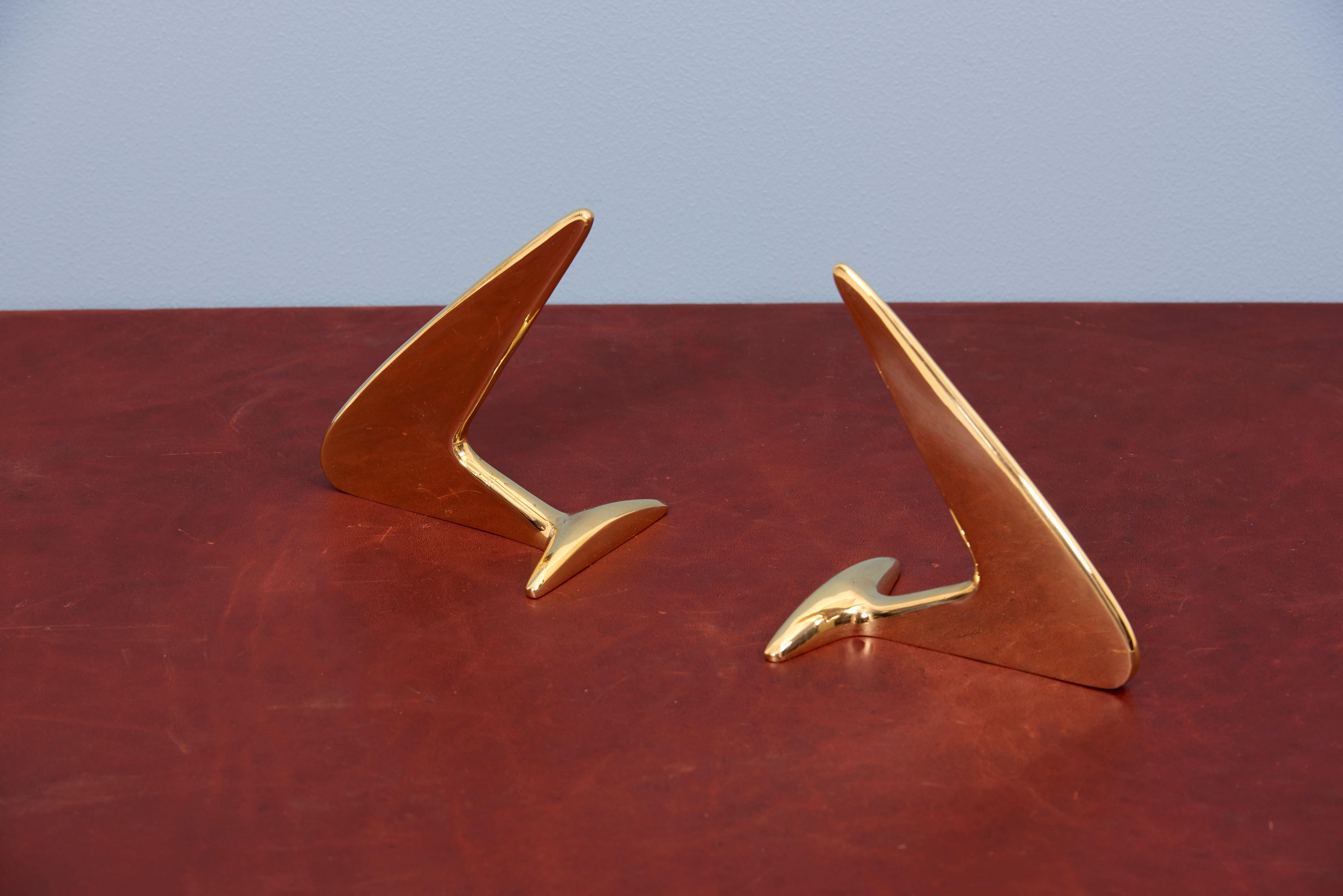 Classic pair of Carl Auböck bookends in a patina and polish brass mix.