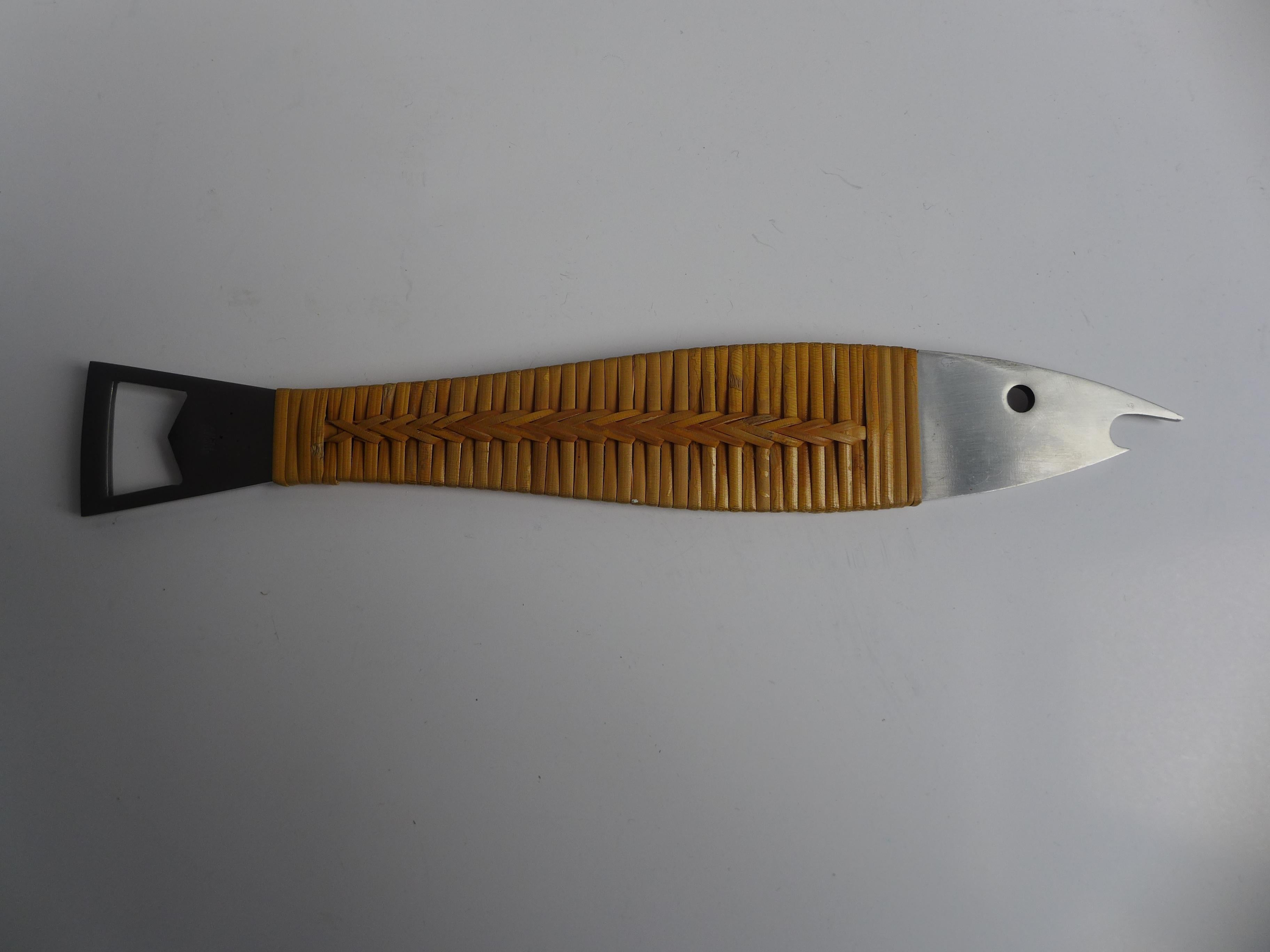 A classic mid-century bottle opener from the Carl Auböck workshop, crafted in the 1950s. The handle is tightly wrapped in natural bast, giving the piece its unmistakable tactile warmth, while the functional end is made of durable stainless