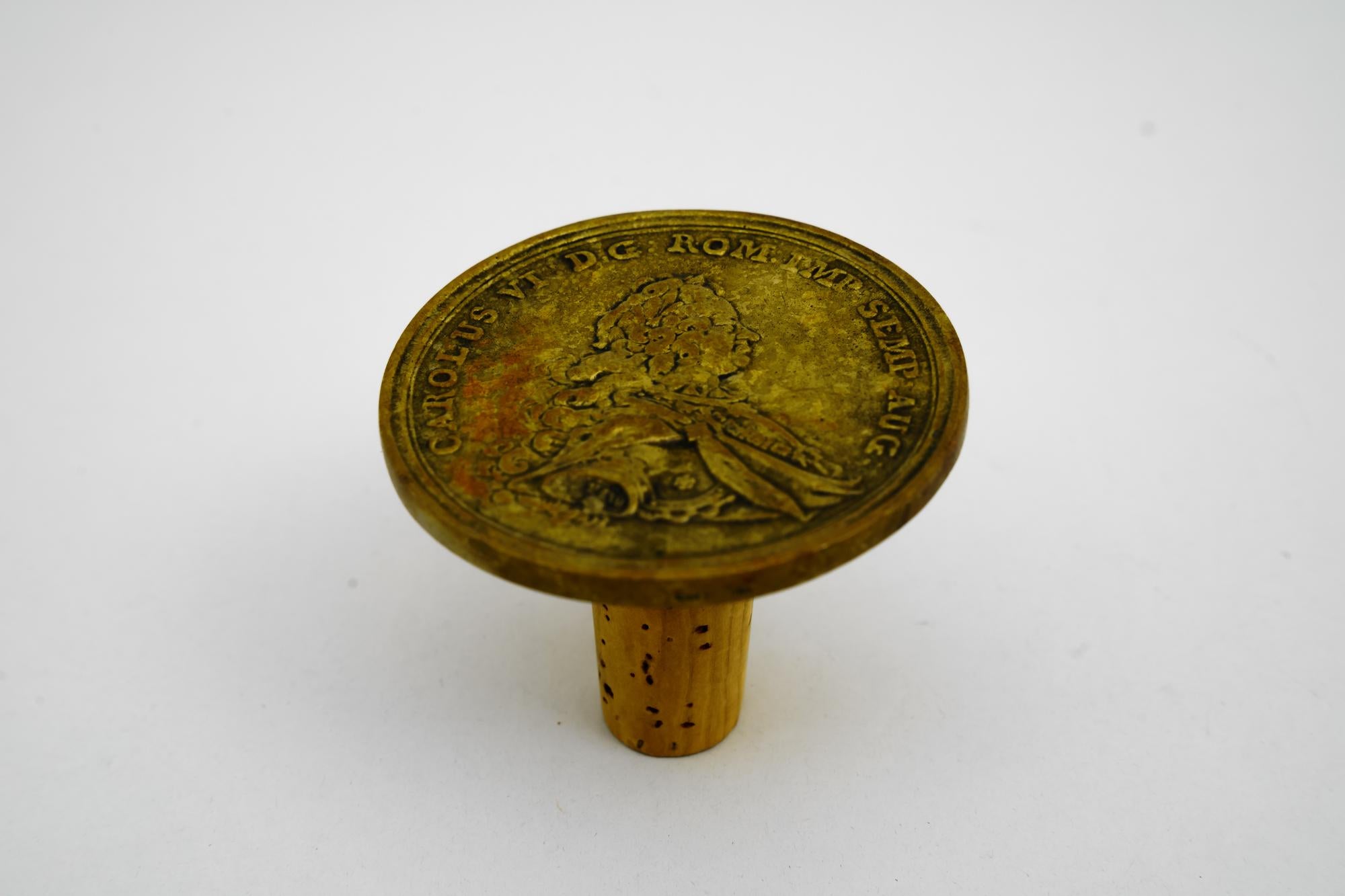 Carl Aubock brass coin bottle stopper, Austria, 1950s
Original condition.