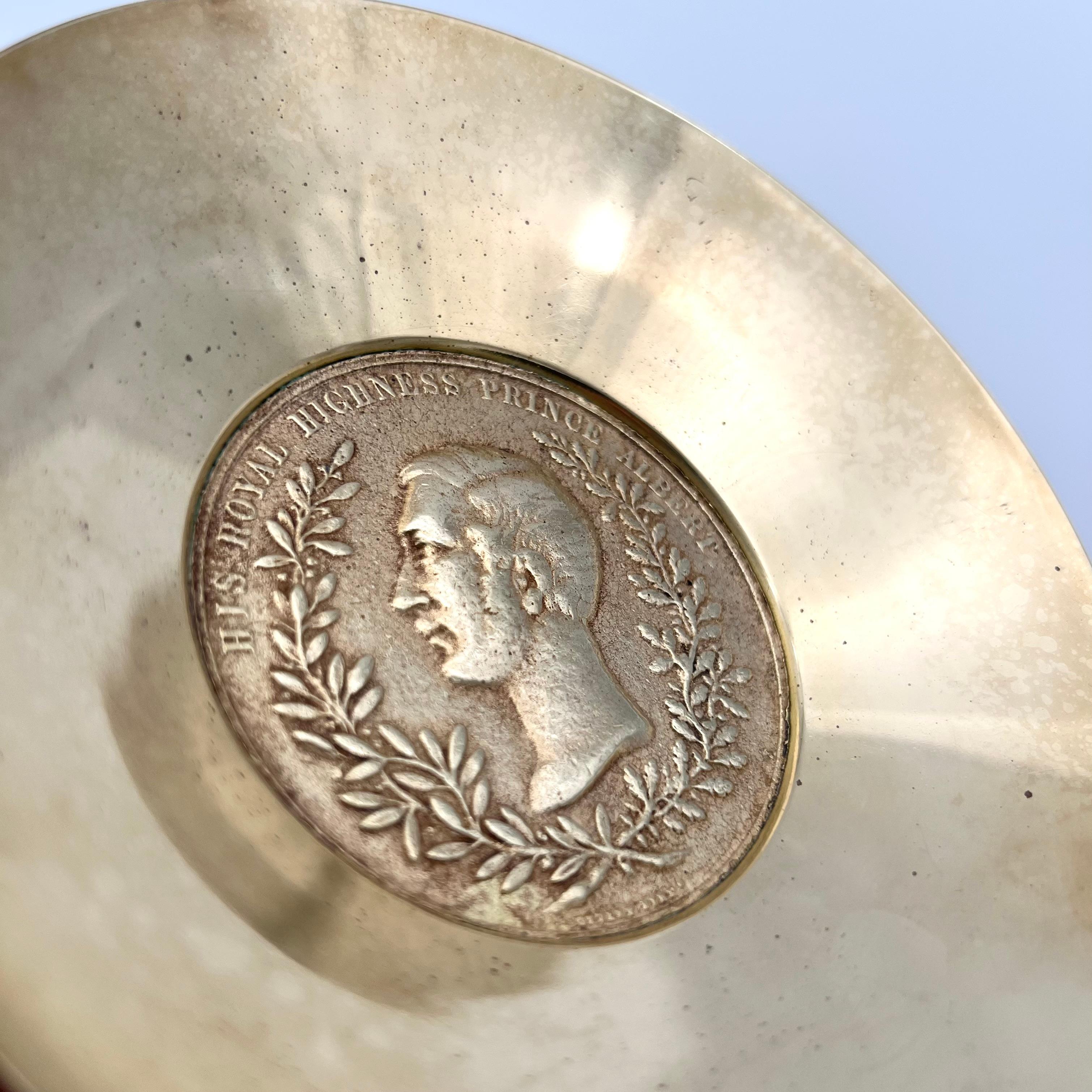 A cool coin tray made of solid brass, by Carl Auböck, unmarked.

The coinbowl is listed in the Auböck Catalogue 