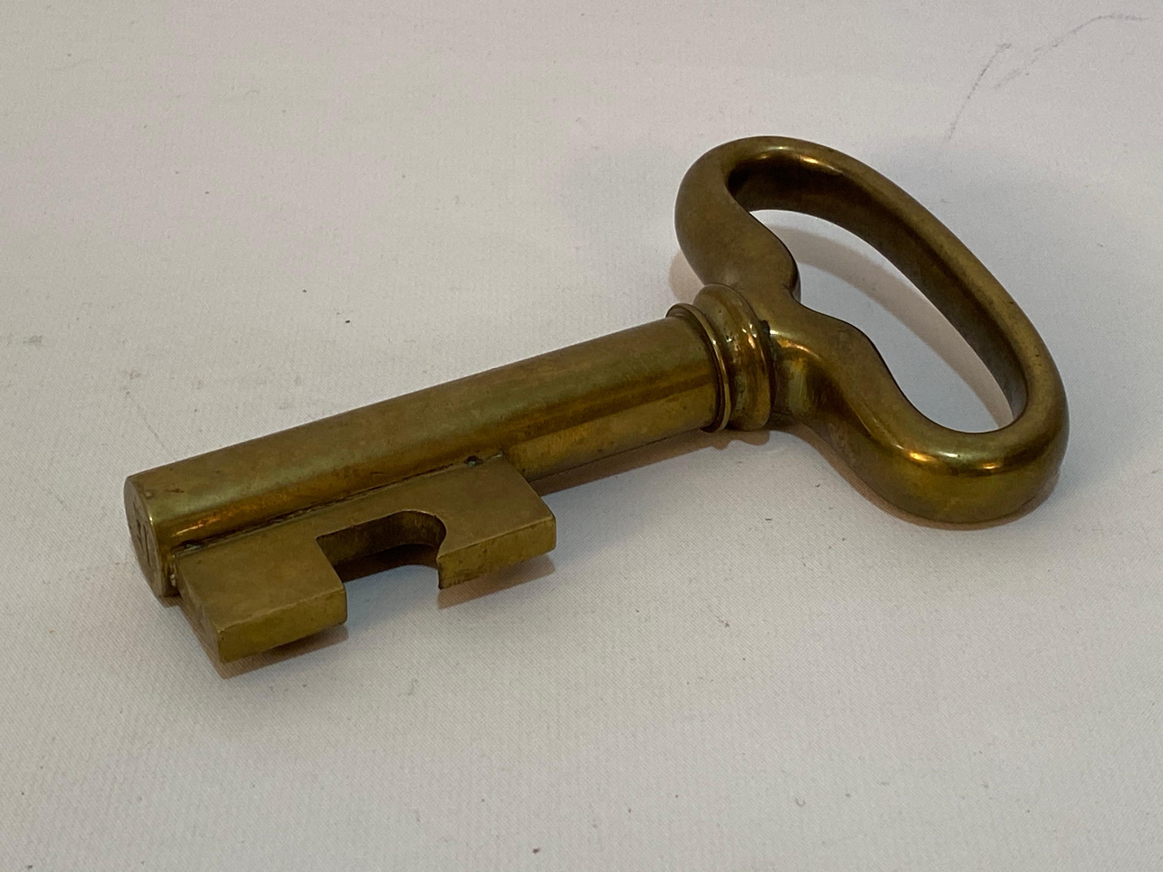 Carl Aubock solid brass key bottle opener and cork screw. Signed Aubock, Made in Austria. Circa 1950. Aubock designs are always a sign of quality, beauty and functional art. Very good condition with some minor tarnish. Lightly used. Some verdi gris