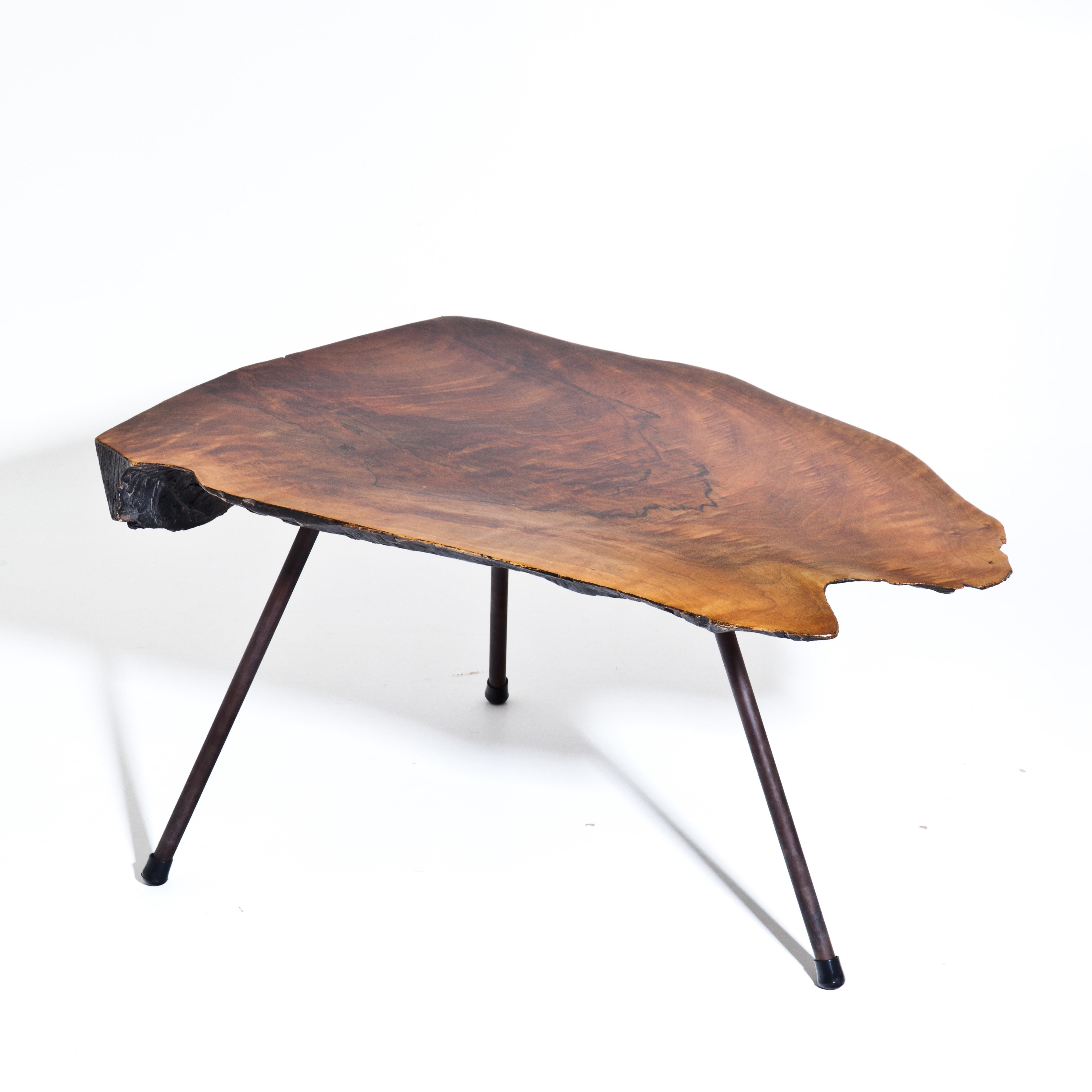 Walnut coffee table by Carl Auböck with three iron feet and blackened underside. Numbered 