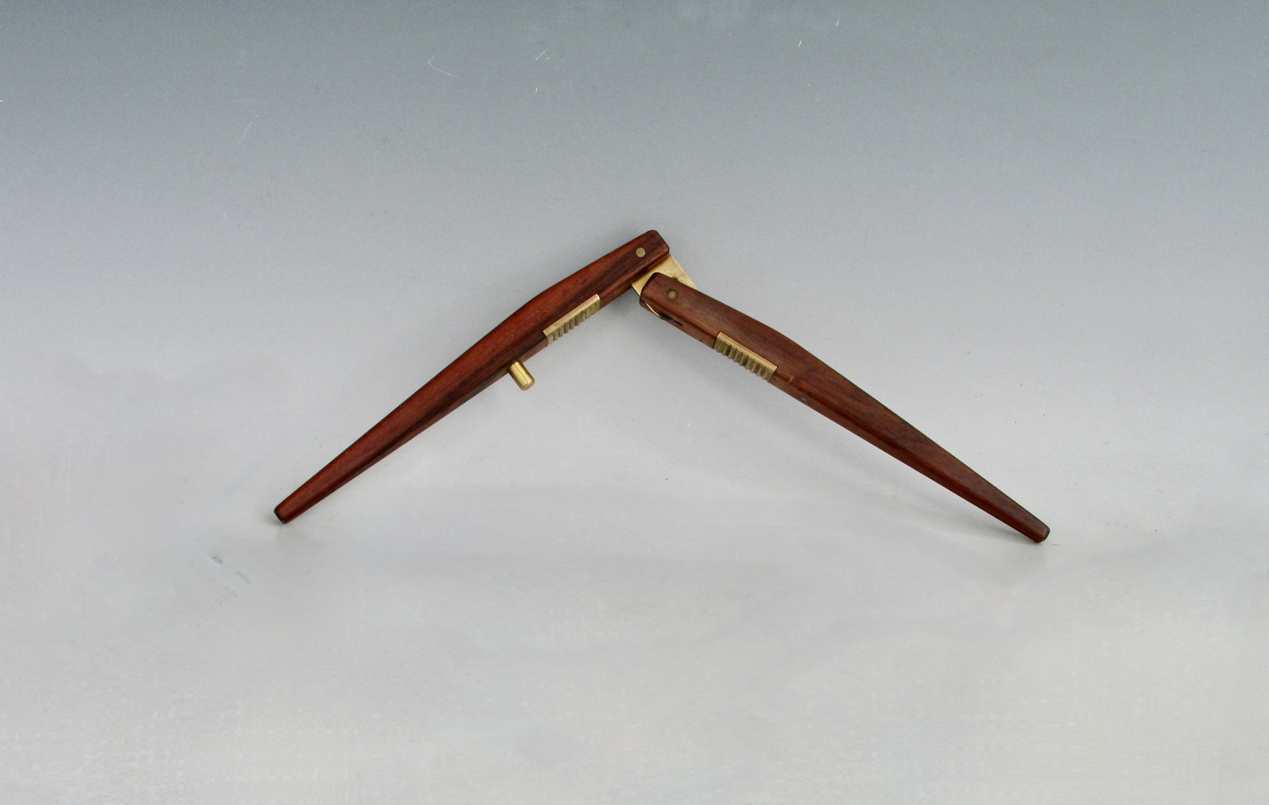 Beautifully made and detailed Nutcracker . Tapered and smoothly finished Rosewood handles mounted with brass hardware .