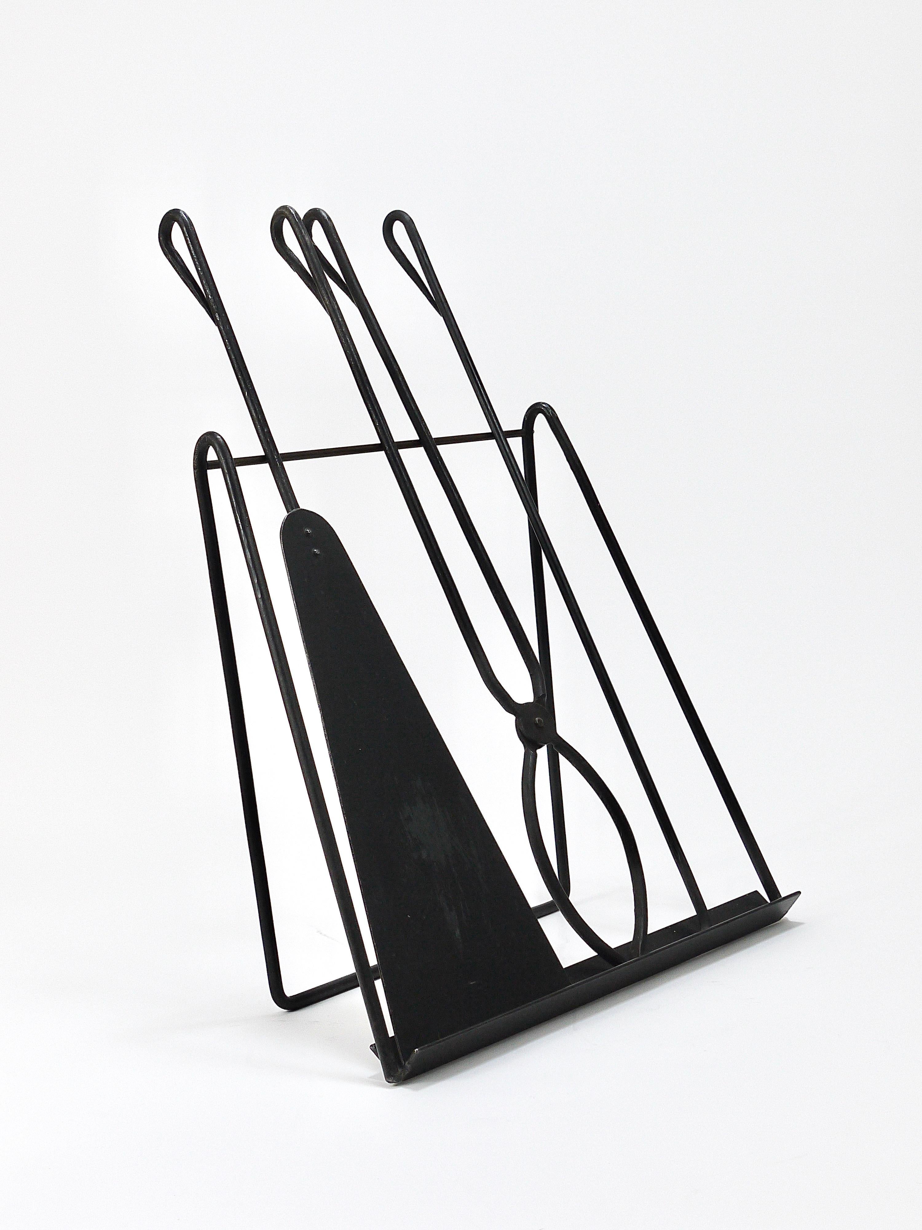 A minimalistic, beautiful Modernist set of three fire tools and stand, designed and executed by Viennese designer Carl Auböck II (1900-1957) in Austria. An original work from the late 1940s, model #4180. Hand-forged of wrought iron, this set
