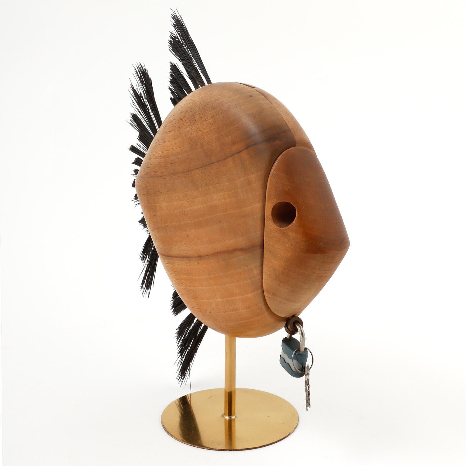 A money box in the form of a fish made of walnut, brass and horse hair designed by Carl Auböck, manufactured by Carl Auböck workshop in midcentury, Vienna, circa 1960.
An authentic handmade piece in very good original condition with nice patina on