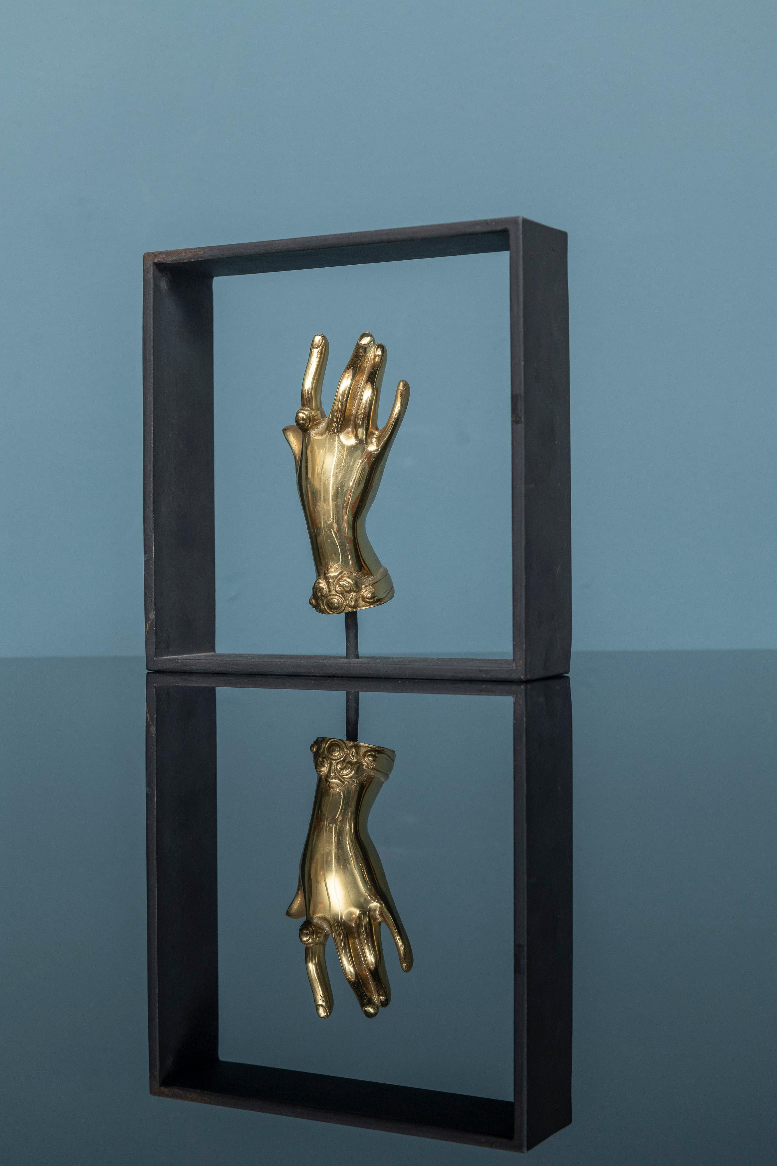 Carl Aubock design solid brass ballerina hand model #5275, Austria. 
Lovely decorative desk or table top object by the master Carl Aubock. Mounted on a flat steel rectangular frame, signed and labeled Aubock, Austria for Neiman Marcus.