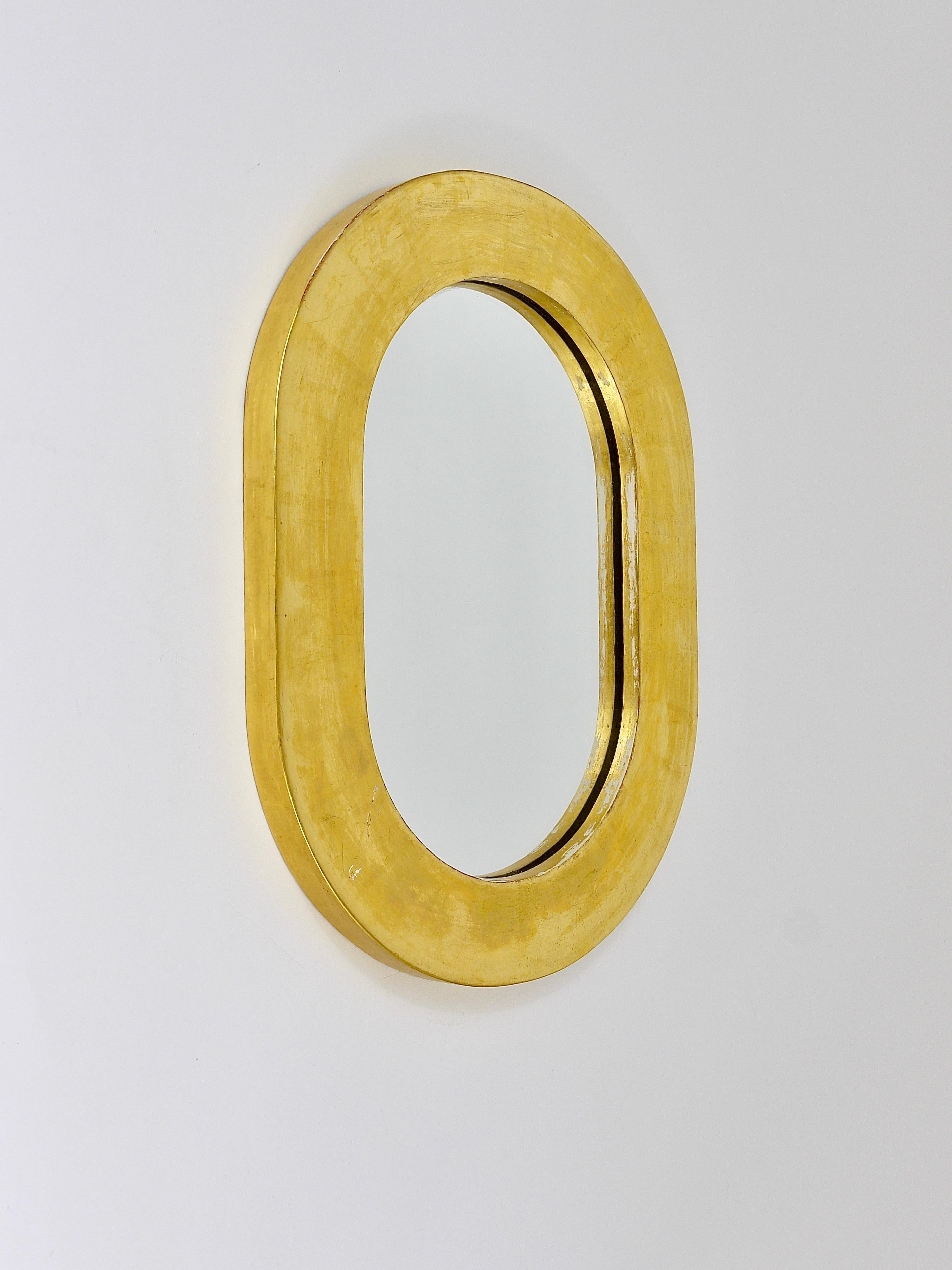 Beautiful Austrian modernist wall mirror. Designed and executed by Carl Aubock, Vienna/Austria. Made of gold-plated wood. In very good unrestored condition, with nice patina. Measures: 12 x 16