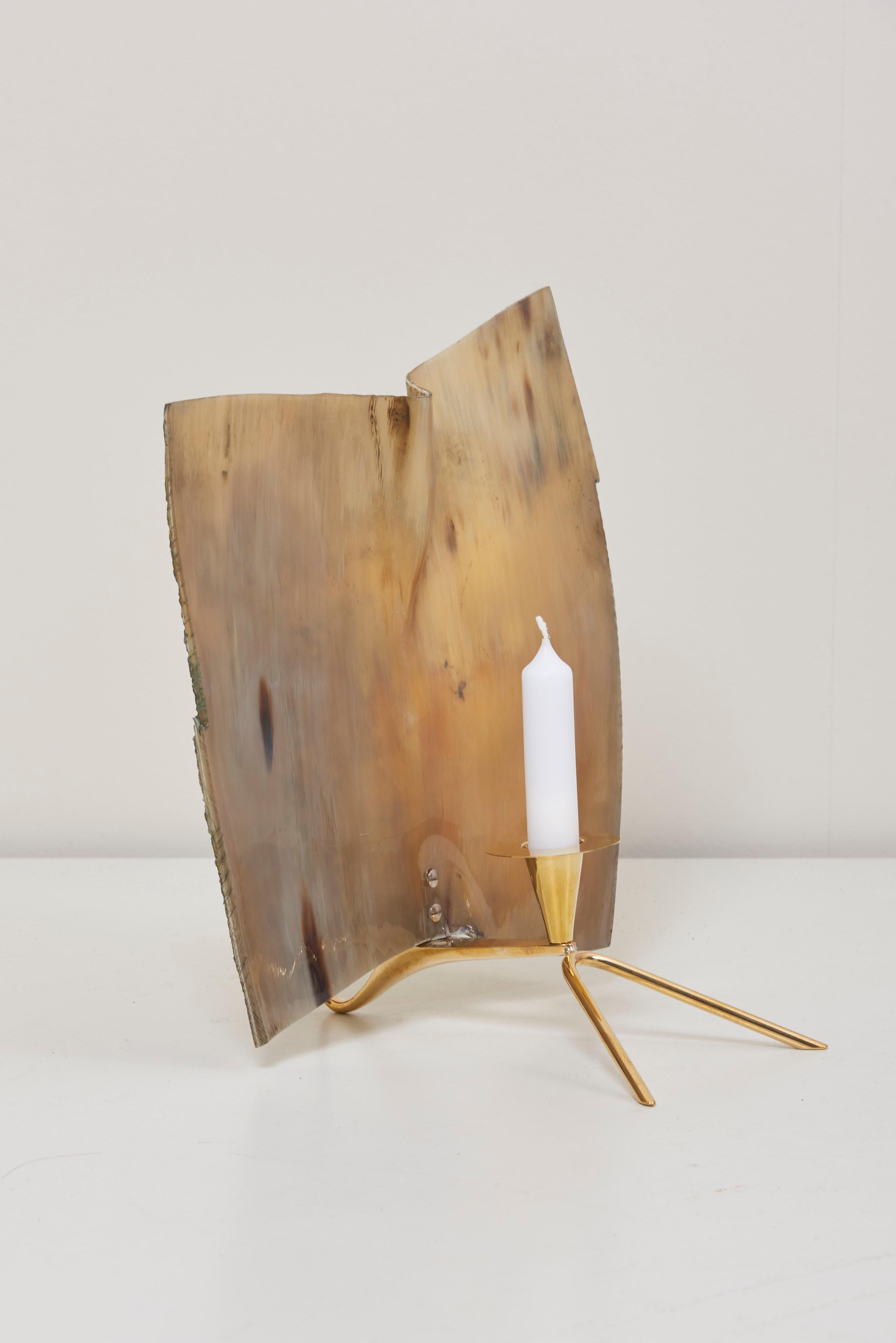 Unusual large horn shade on this classic Carl Auböck candle holder in polished solid brass.

