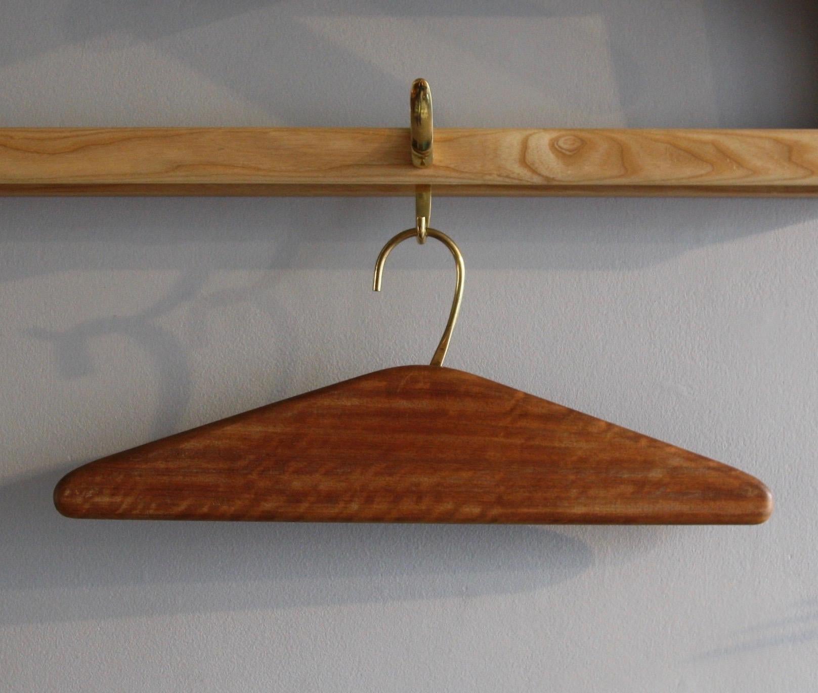 A vintage coat hanger or “kleiderbügel” designed and made by Carl Auböck II, Vienna, circa 1950. The hanger is model number 4650 in the Werkstätte Carl Auböck catalogue and was made to order as a solid triangle, as we see here, or with a slit cutout