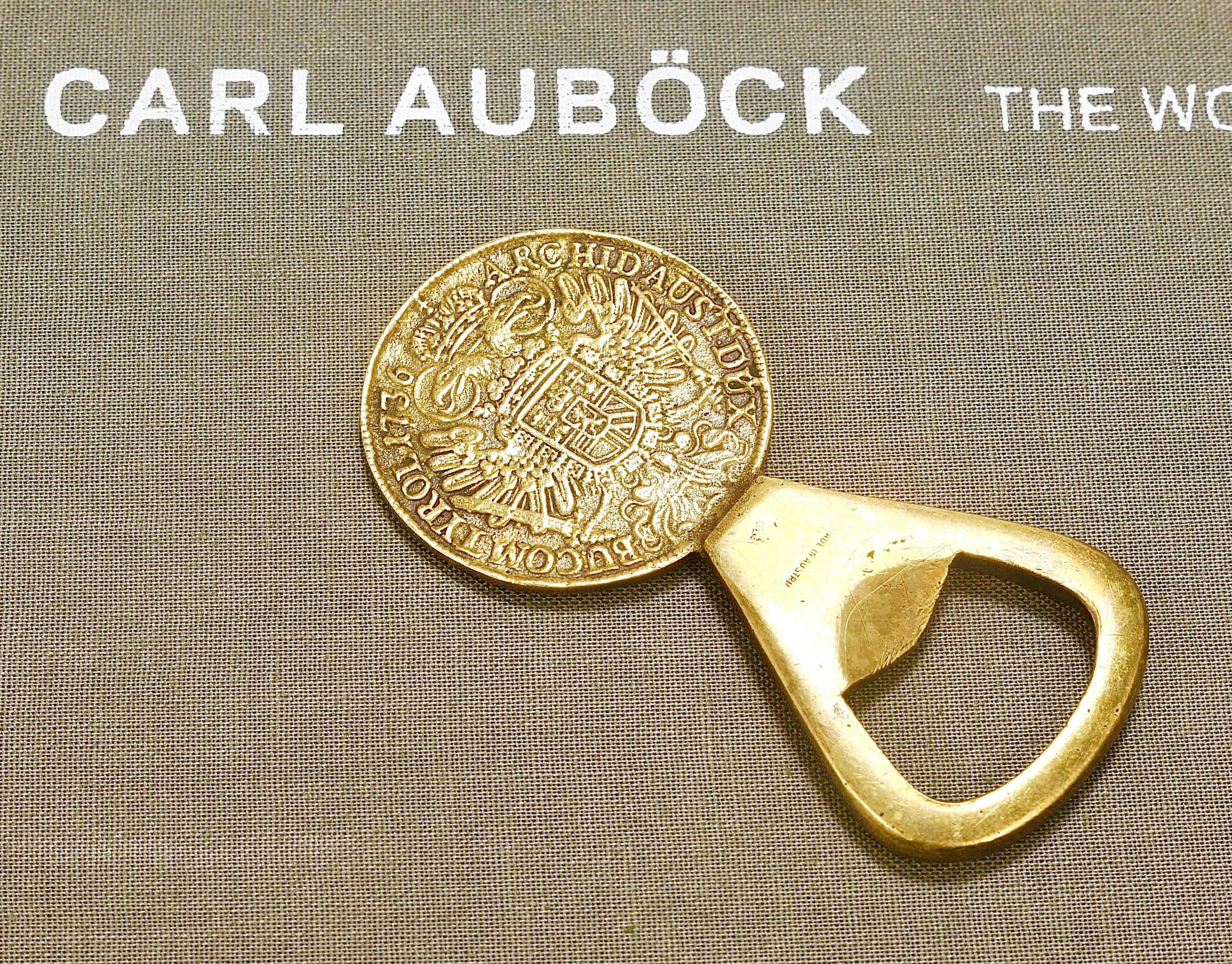 A beautiful solid brass bottle opener, designed and executed by Carl Auböck II in the 1950s. Marked: Made in Austria. In good condition with nice patina.