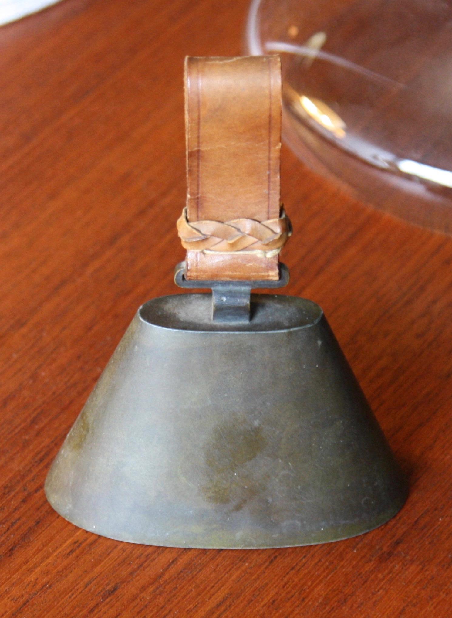 An early 1940s bell designed and made by Carl Auböck II. The body of the bell is cast pewter whilst the handle is made from leather. In excellent, completely original, condition.