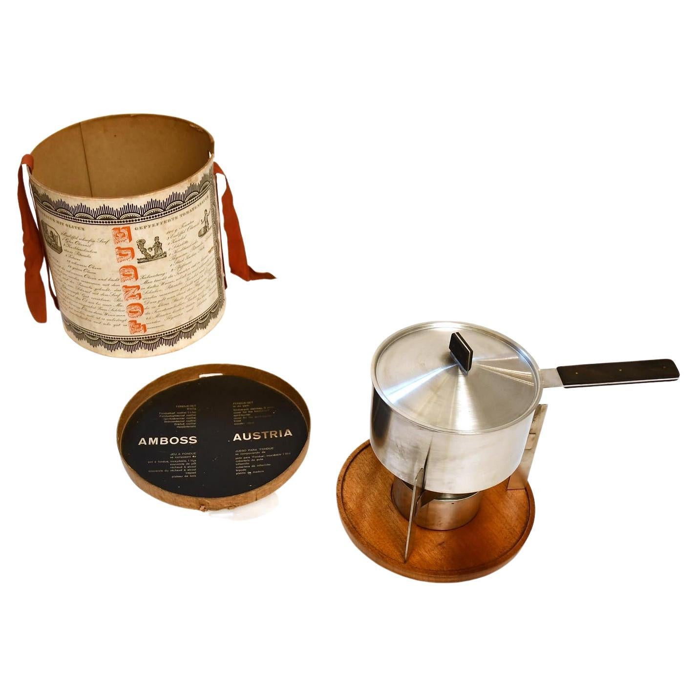 https://a.1stdibscdn.com/carl-aubock-ii-fondue-set-mid-century-nutwood-steel-austria-1960-for-sale/f_54232/f_308214921665592570270/f_30821492_1665592570679_bg_processed.jpg