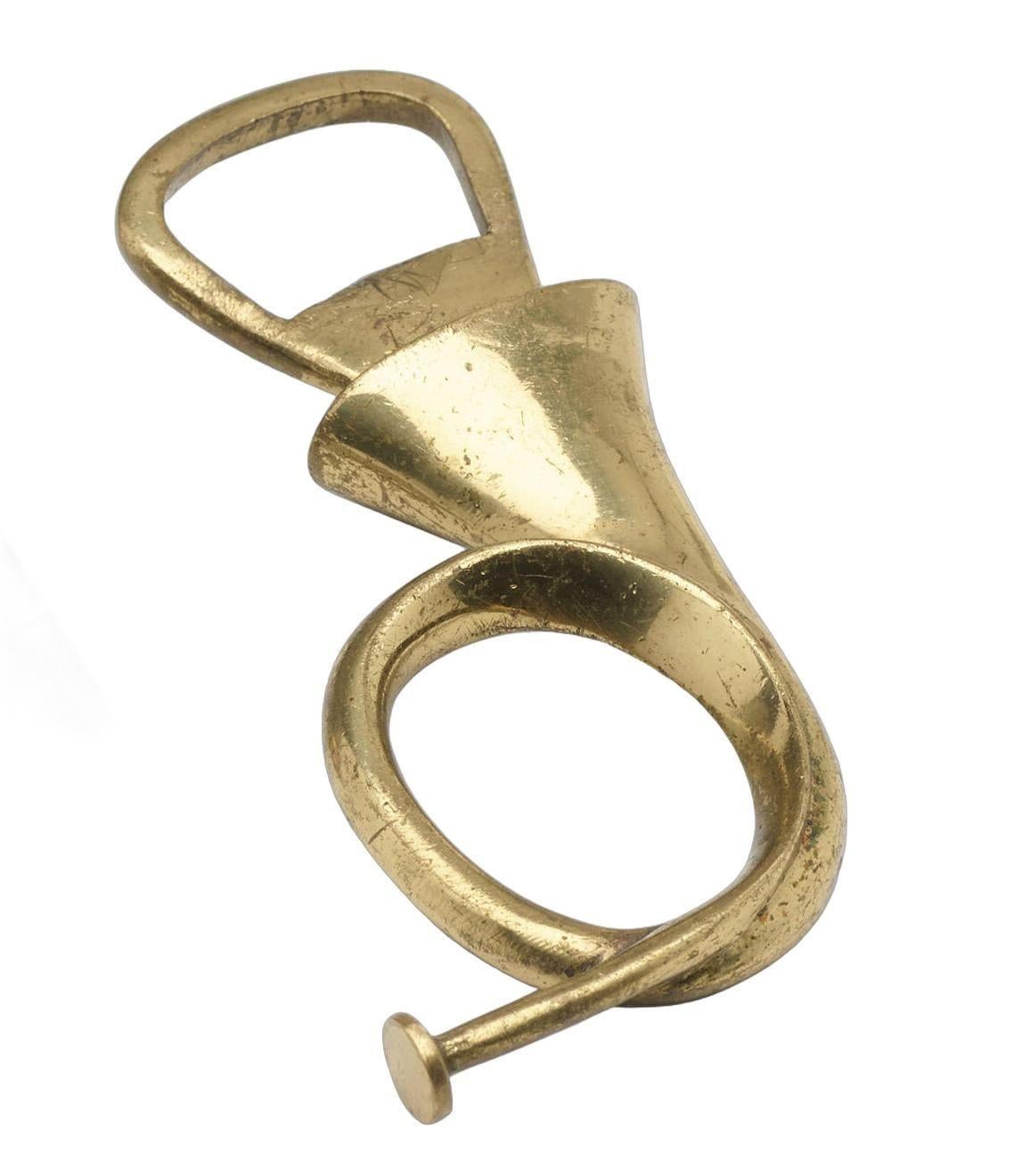 Carl Auböck II French Horn Bottled Opener, 1950 model 4567, Werkstätte Carl Auböck, Austria
Impressed manufacturer's mark to underside of French horn 'Made in Austria’
Solid Brass with a slight patina and scratches consistent with age and