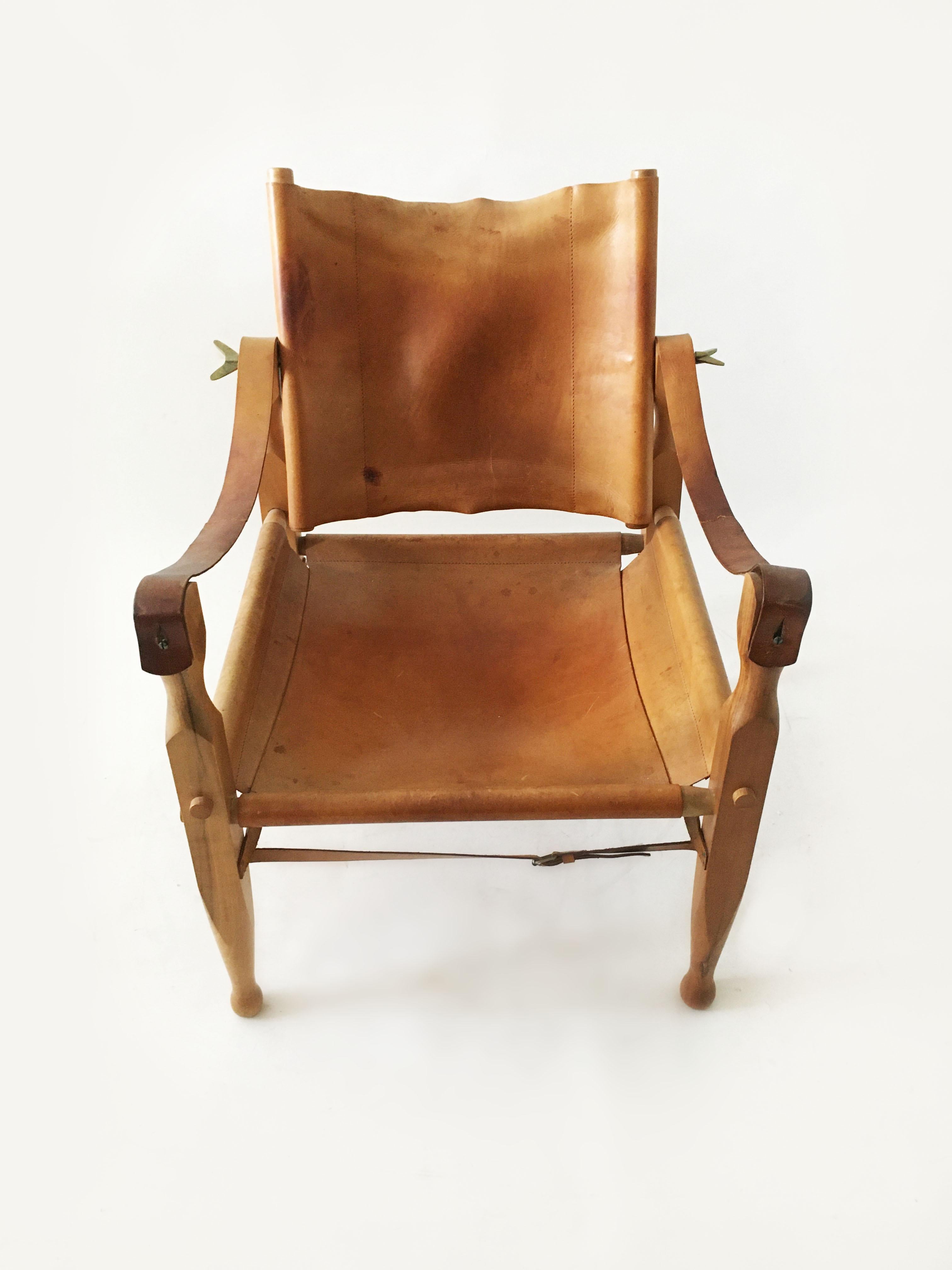 Carl Auböck II. Safari chair model 4979, patinated cognac leather, Austria, 1950s. A single vintage safari chair from Carl Auböck II, made in the 1950s. The leather is patinated and has mellowed over time resulting in a soft touch and showing warm