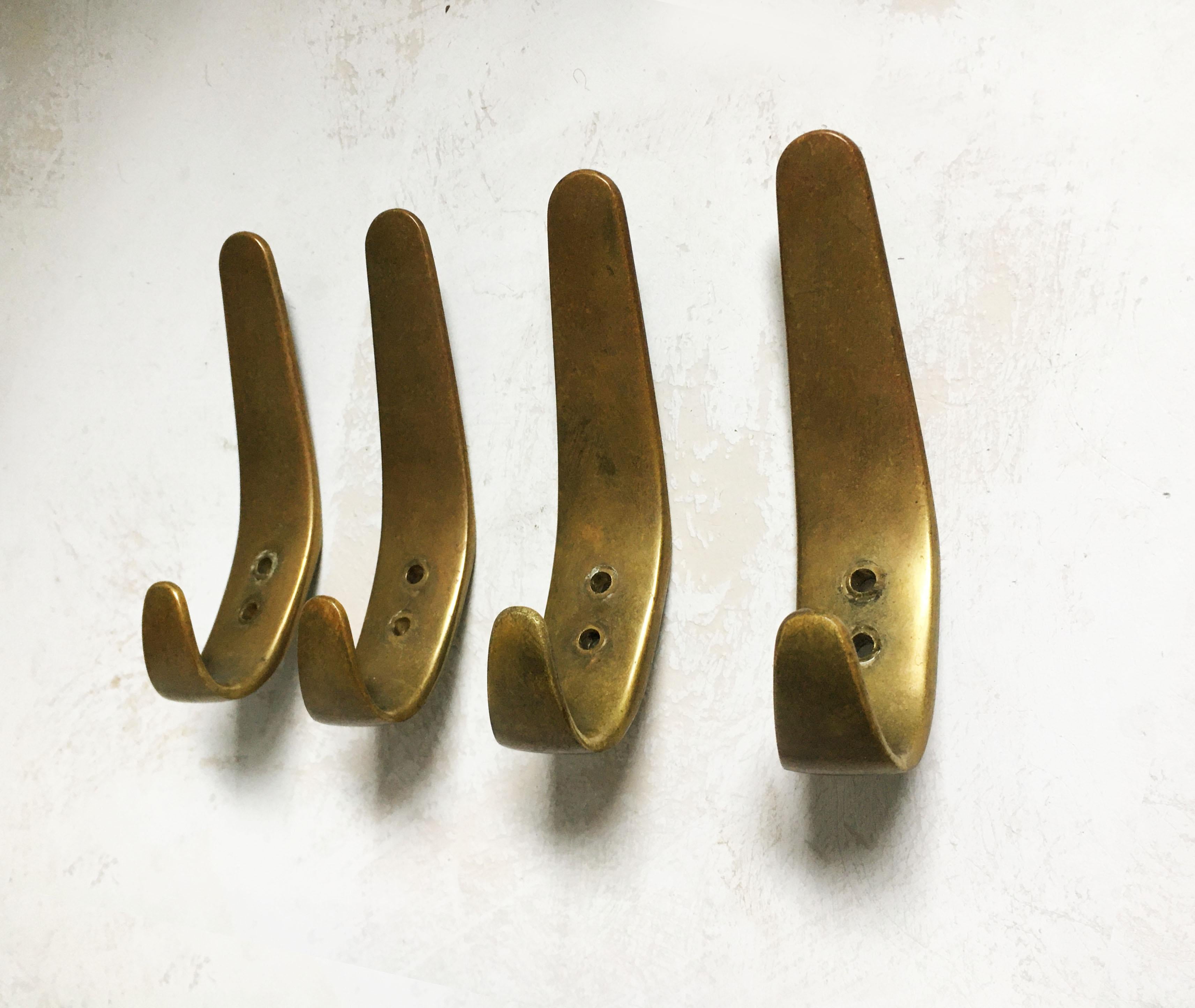 Carl Auböck II wall hook patinated brass set of four model '4330', Austria, 1950s.