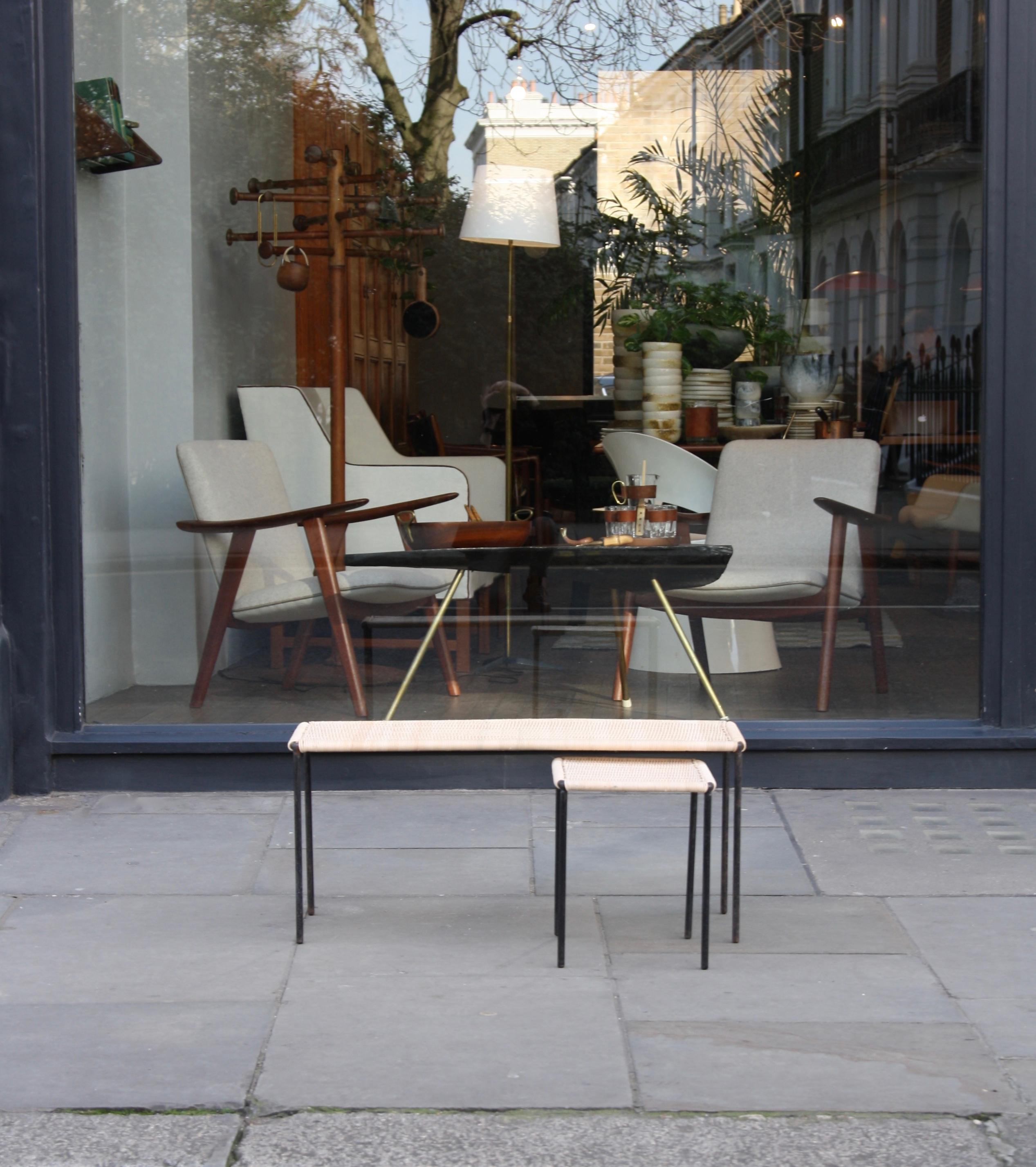 A long rectangular table designed and made by Carl Auböck II, Vienna, Austria, circa 1950.
The table's frame is made from slender steel bar which has been lacquered in black. The table top is constructed entirely from tightly woven wicker.
The