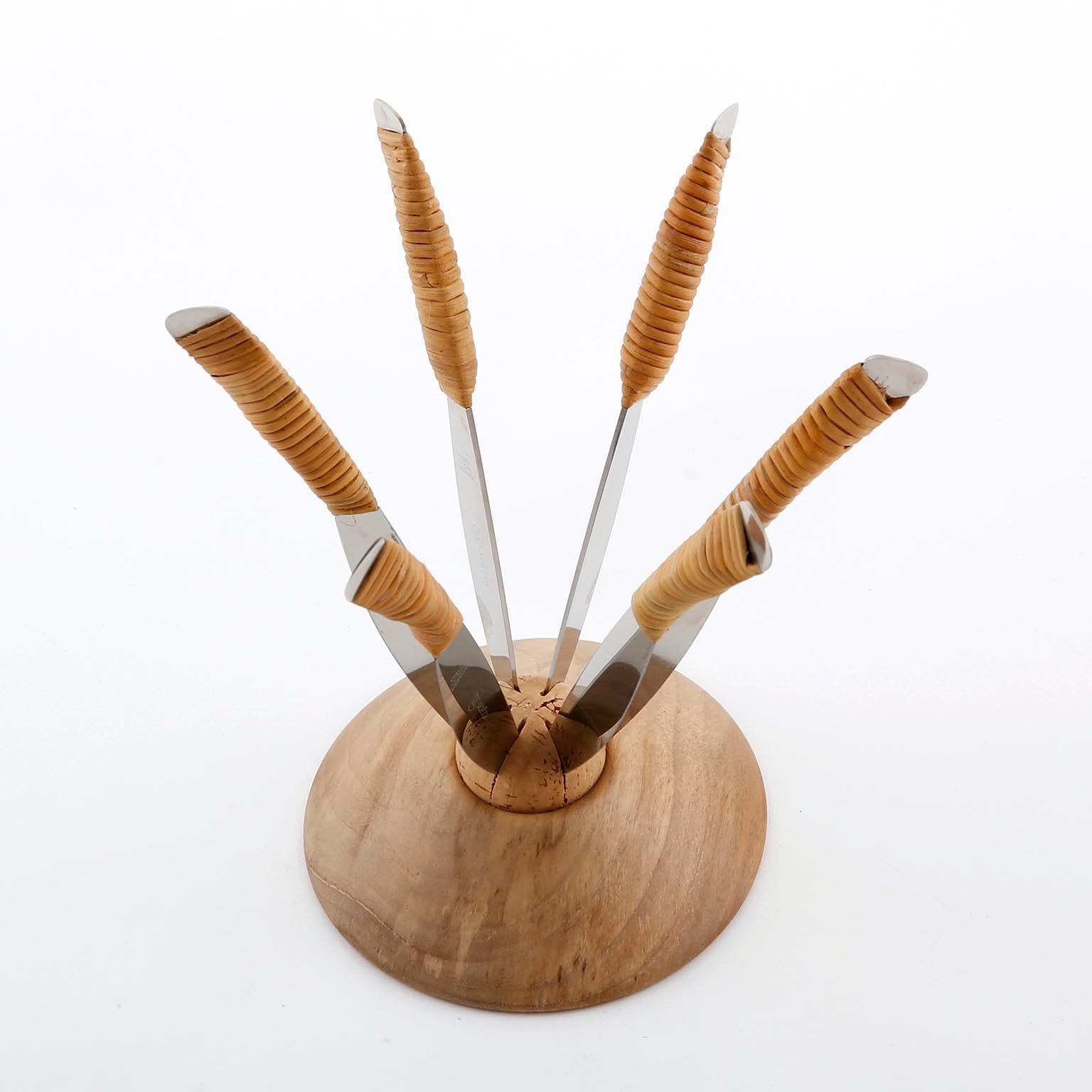 A knife holder set with six knives designed by Carl Auböck, manufactured by Carl Auböck workshop in midcentury, Vienna, circa 1950.
Great to accompany a cheese board or fruit course. 
The holder is made of wood and cork. The knives are made of
