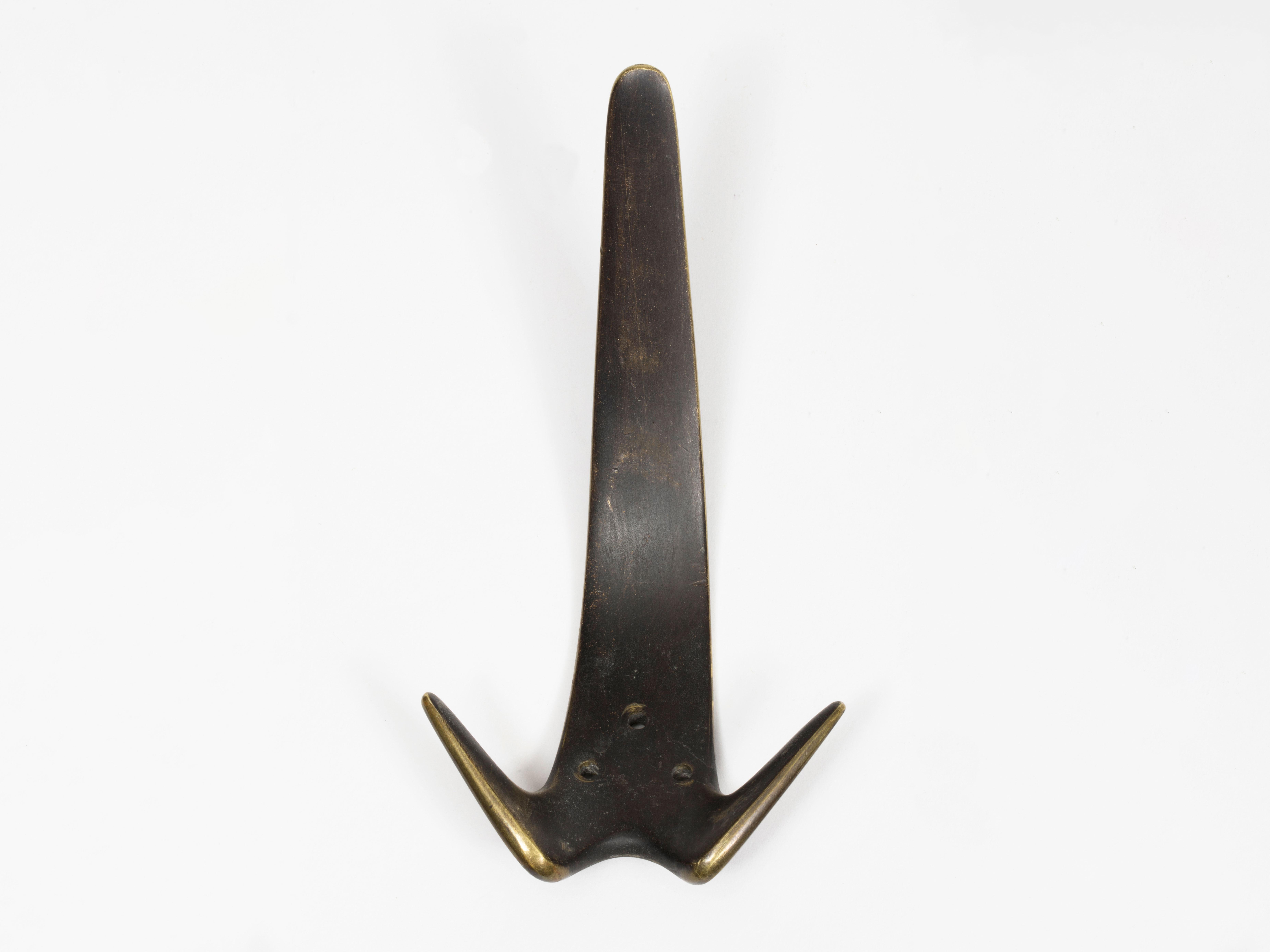 Large modernist cast brass wall hooks by Viennese designer Carl Auböck. Original works from the 1950s. Sold separately. 7 Available.