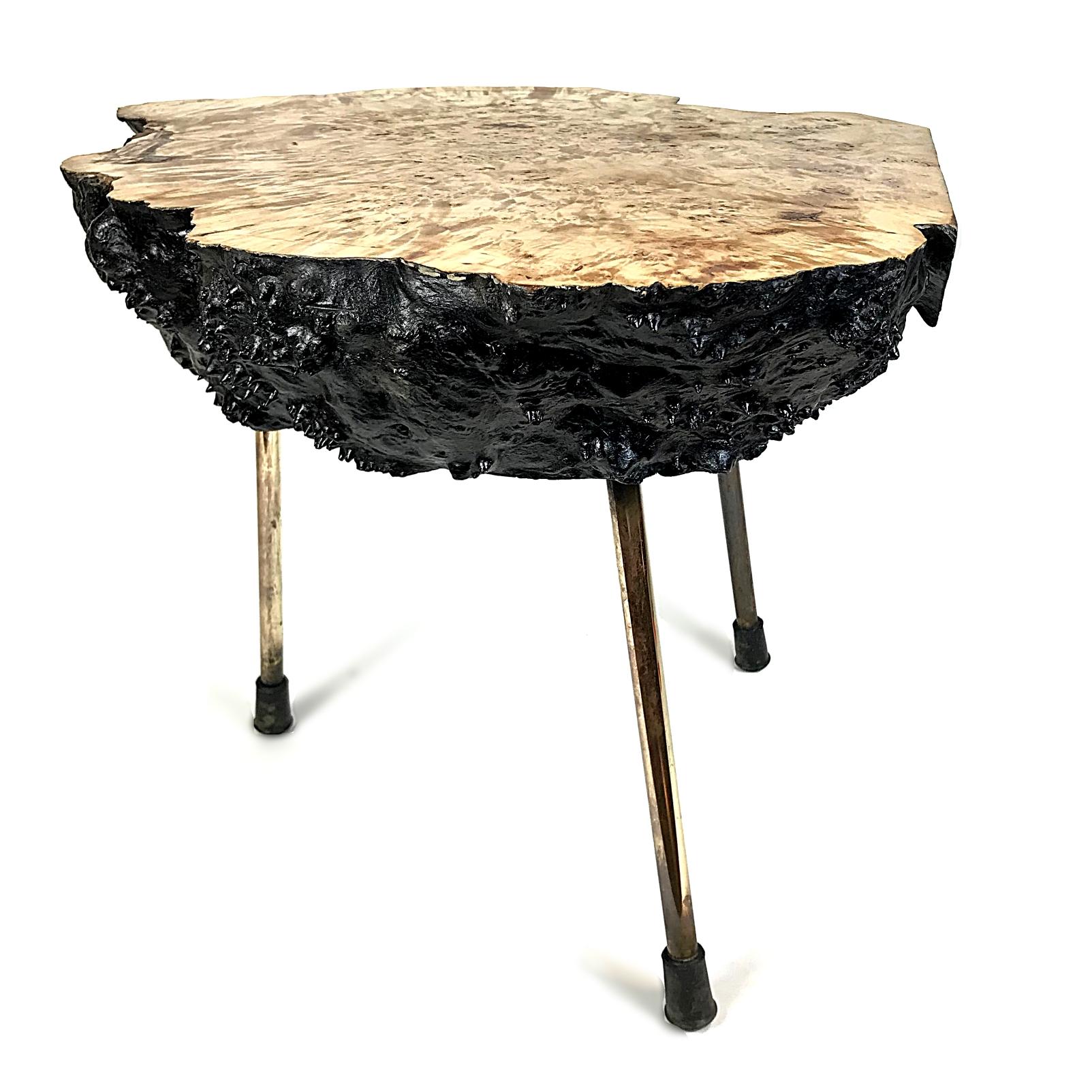 Beautiful tree trunk table by Carl Auböck. The table is made of burl walnut slub with three brass legs. The tabletop was shellack polished. The table is embossed with 'Auböck Made in Austria' on the bottom.

We ship via UPS-Express