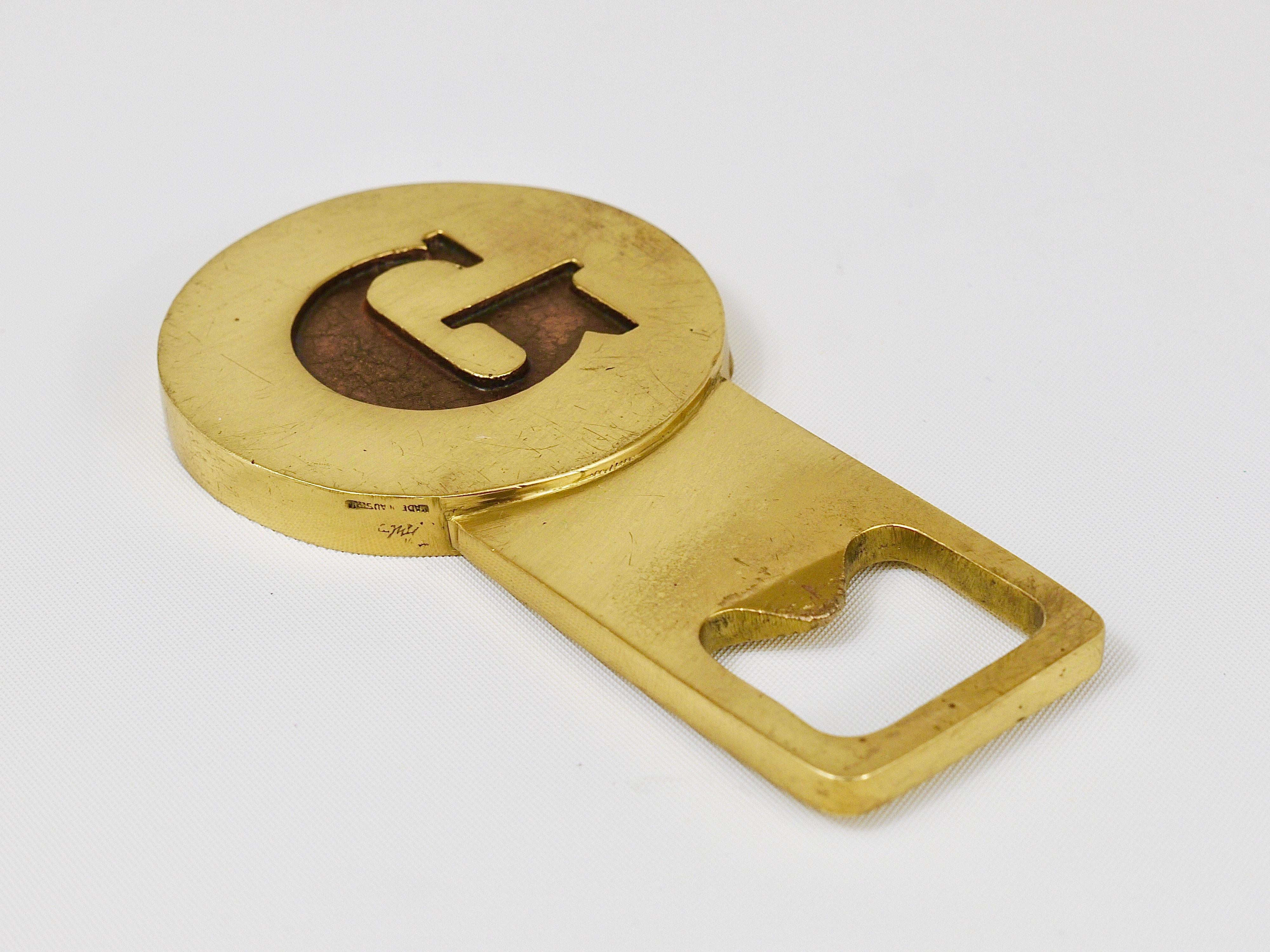 A beautiful modernist bottle opener, displaying the letter G, made of solid brass. Designed and executed in the 1960s by Carl Auböck, Austria. In good condition with patina. Marked.