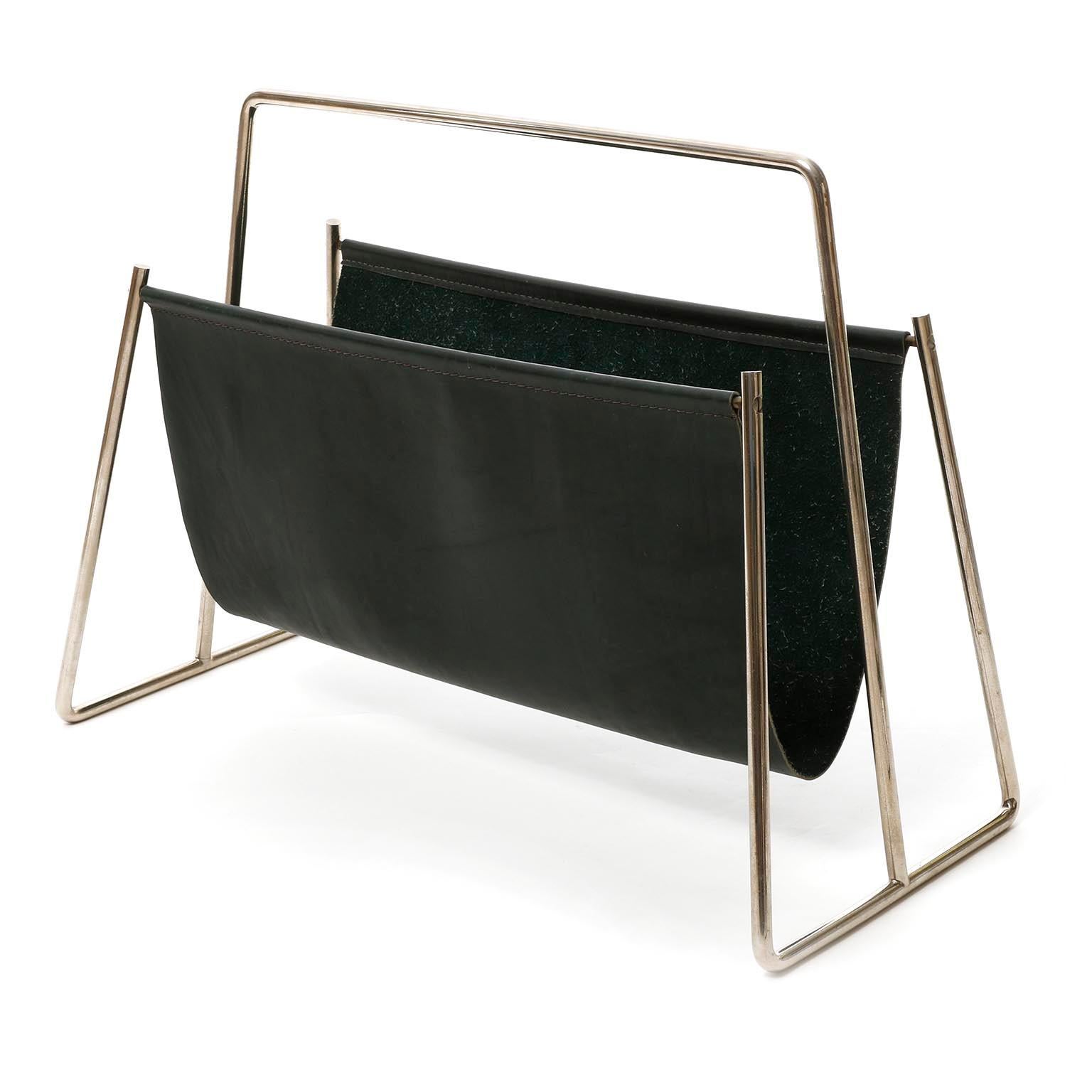 A gorgeous and large magazine or newspaper tray made of nickeled brass and moos or dark green leather designed by Carl Auböck in midcentury in 1950s.
Very good condition with nice patina on nickel.

Lit.: Carl Auböck The Workshop, Clemens Kois,