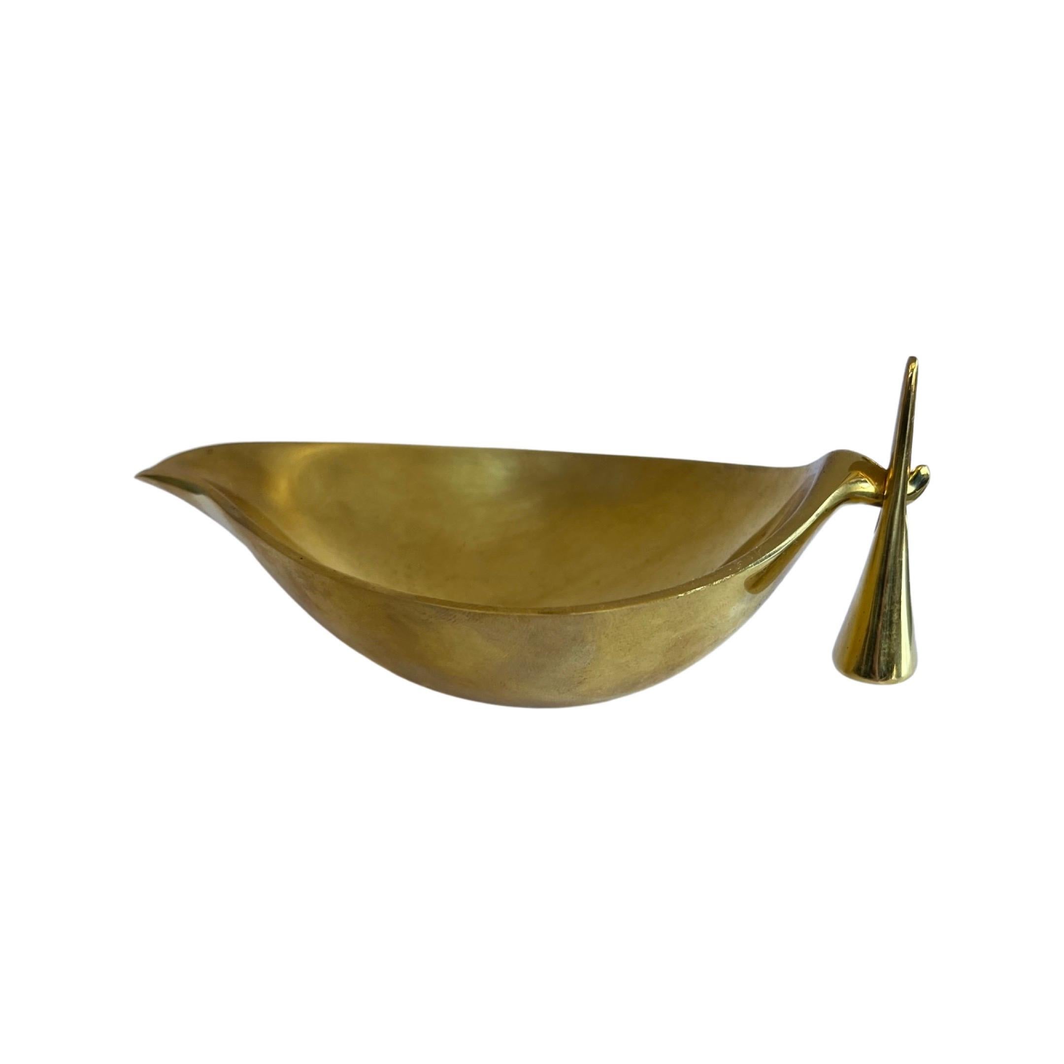 Carl Aubock Mid-Century Modern brass ashtray and snuffer. A 1950s design produced by Carl Auböck IV in the original Auböck workshop in Vienna, Austria using the same standards, high-quality materials, original molds and techniques of his