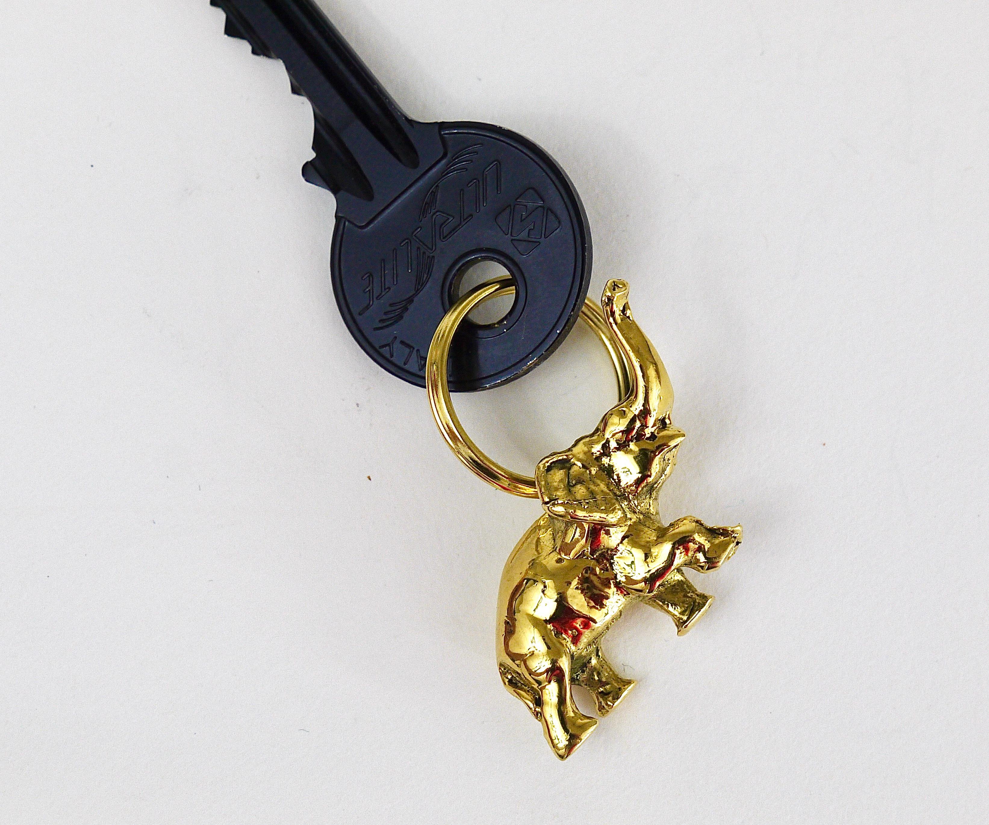 A charming modernist elephant keyring / keyholder / keychain, designed by Carl Auböck in the 1950s. Handmade of solid polished brass by Werkstätte Auböck in Austria. Fully stamped and marked.

Measure: Length: appr. 1 1/2 inches

This is a
