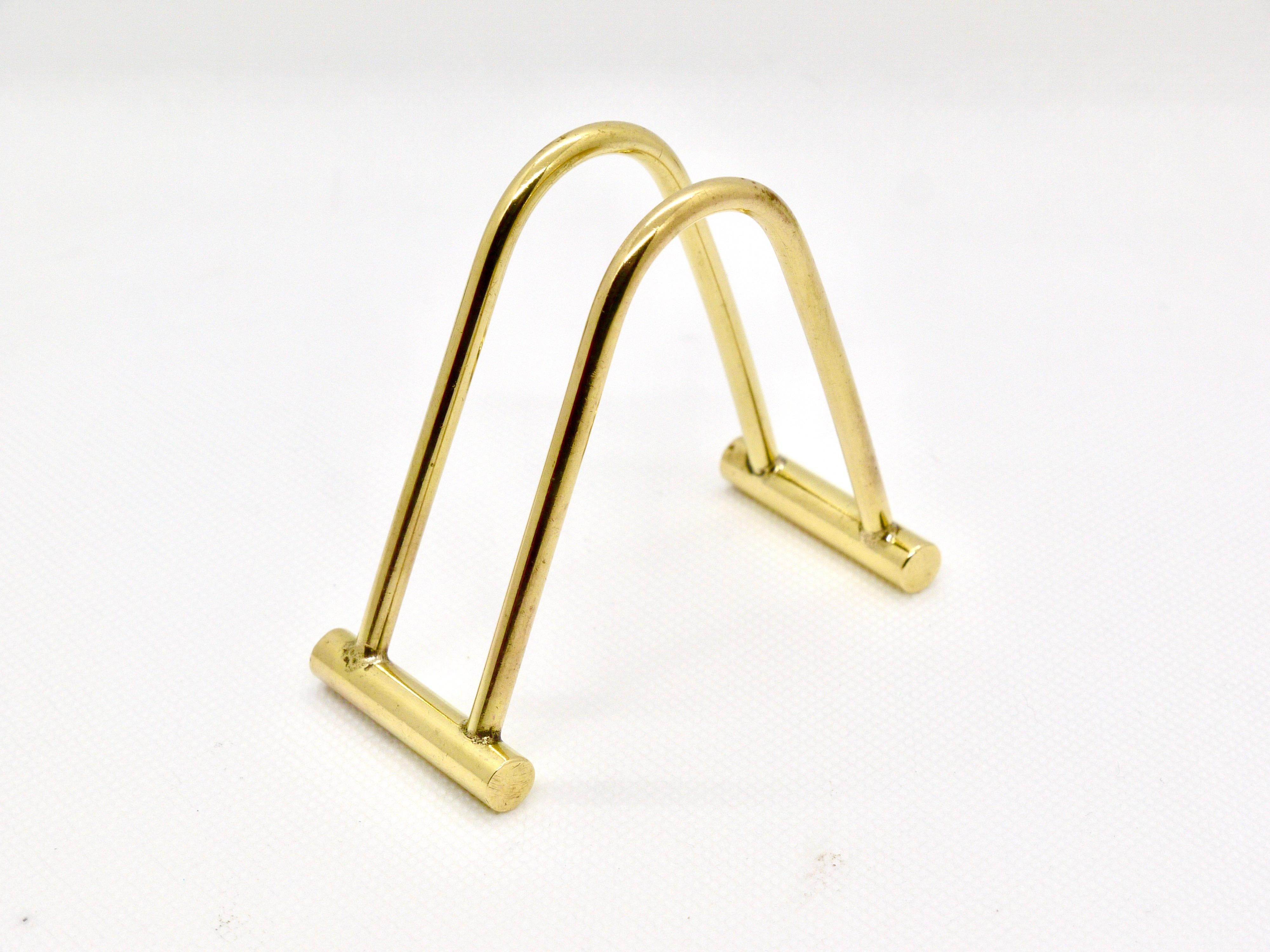 A beautiful card stand, made of polished brass, designed and executed in the 1950s by Carl Auböck, Austria. In very good condition.