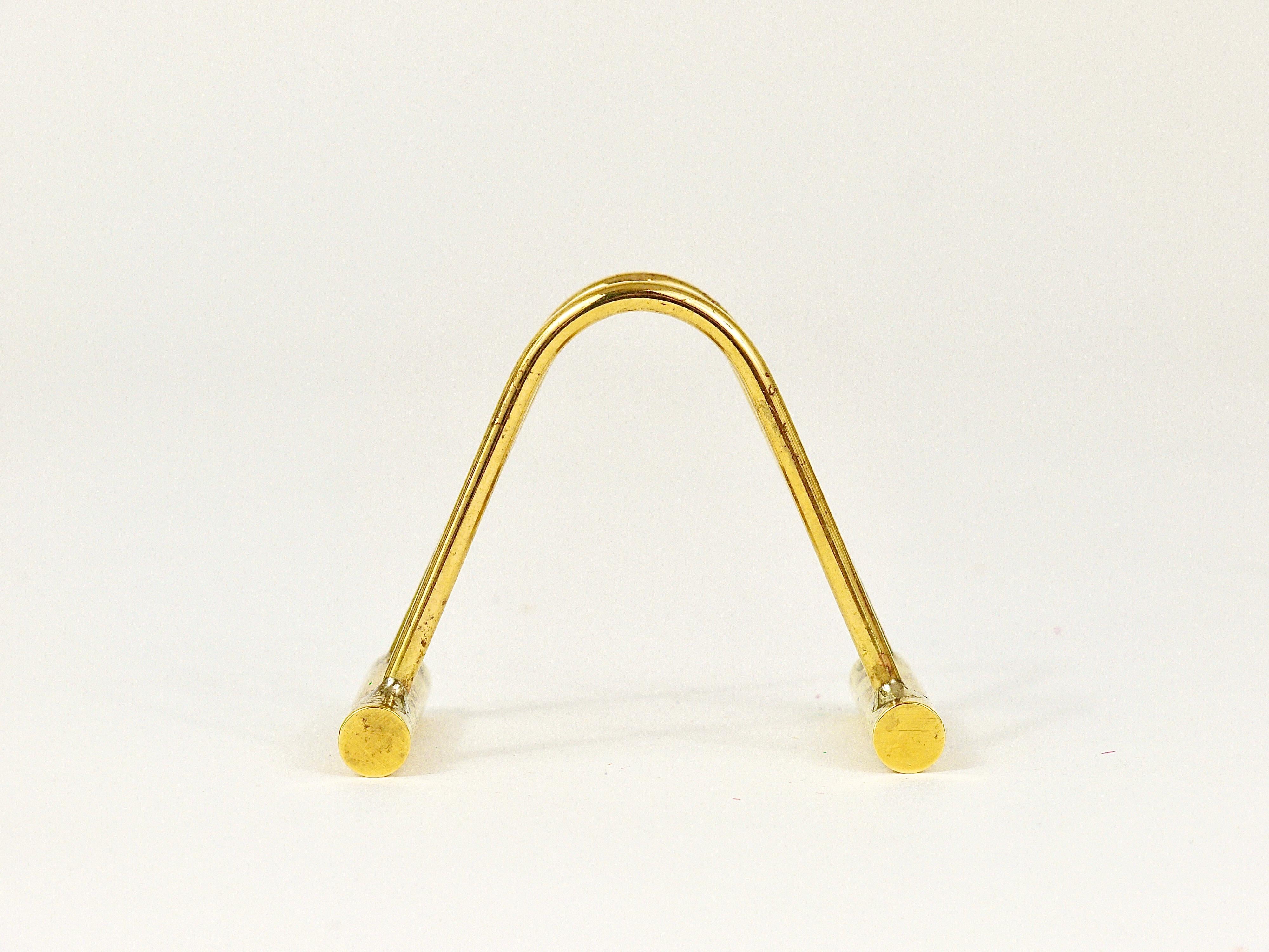 A beautiful card stand, made of polished brass, designed and executed in the 1950s by Carl Auböck, Austria. To be used for business cards, folders, flyers, menus, coasters etc. In very good condition.