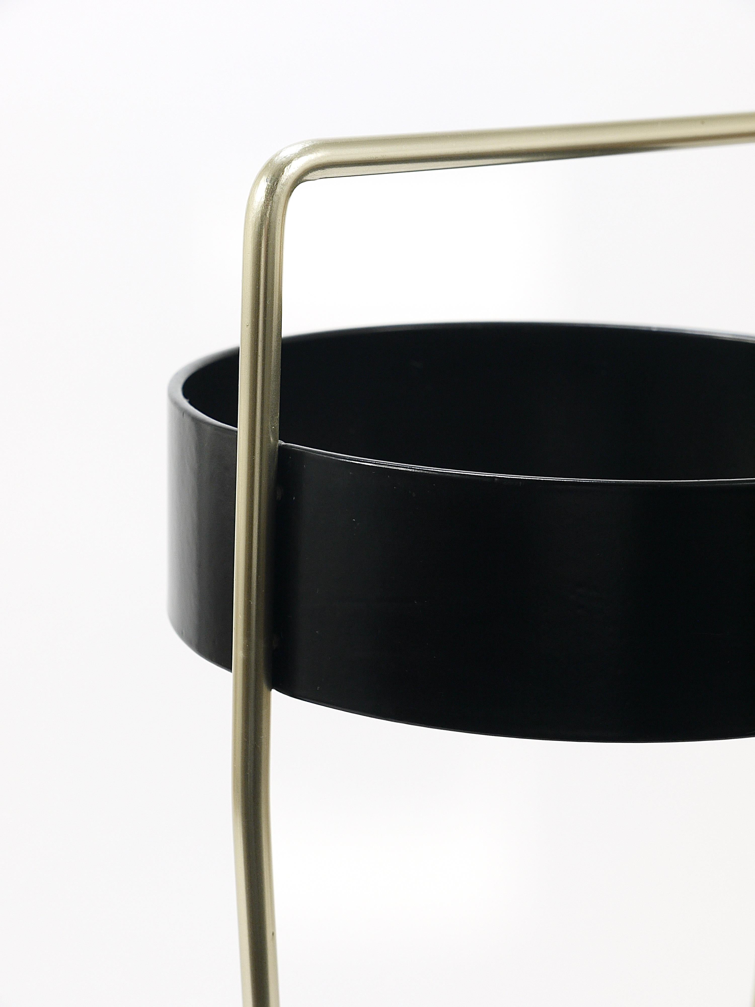 We are pleased to offer the pictured mid-century umbrella stand / holder. It dates from the 1970s and was designed by Carl Auböck III and handcrafted by the Werkstätte Auböck in Vienna. The umbrella stand features Auböck's characteristic minimalist