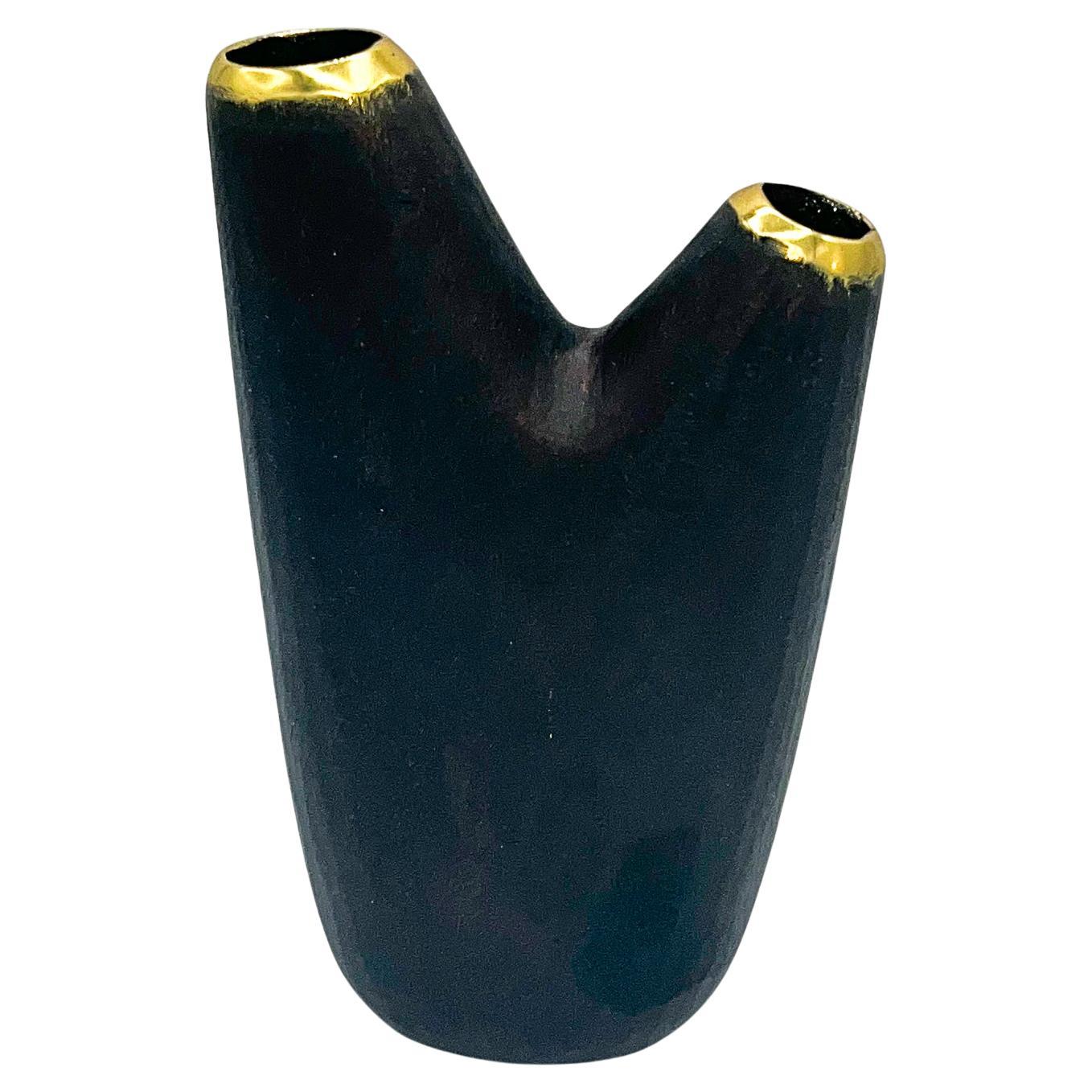 Carl Aubo¨ck Model #3794 'Aorta' Brass Vase. This exceptionally crafted vase by Carl Aubock is a wonderful example of the marriage of form and functionality that has made the Aubock name synonymous with great design. Aubock items have become highly