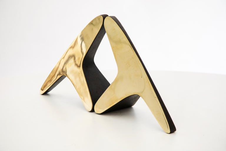 Pair of Carl Auböck Model #3847 brass bookends. Designed in the 1950s, this incredibly refined and sculptural pair of bookends are executed in polished and patinated brass. 

Price is for the pair. One pair in stock ready to ship. Available in