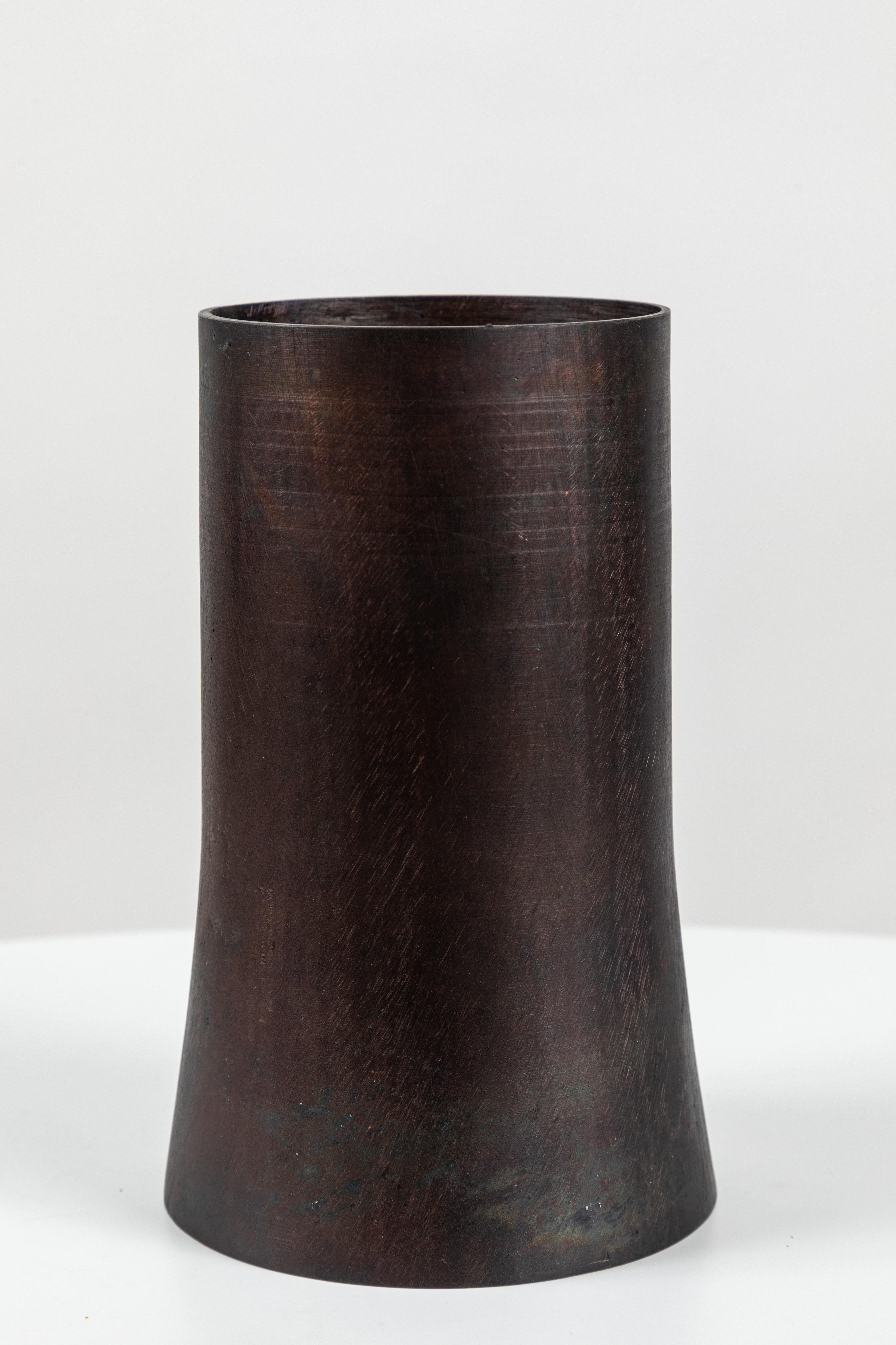 Carl Auböck Model #3854 'Atom 2' brass vase. Designed in the 1950s, this incredibly refined and sculptural Viennese vase is executed in darkly patinated brass by Werkstätte Carl Auböck, Austria. 

Price is per item. Two in stock. Available in