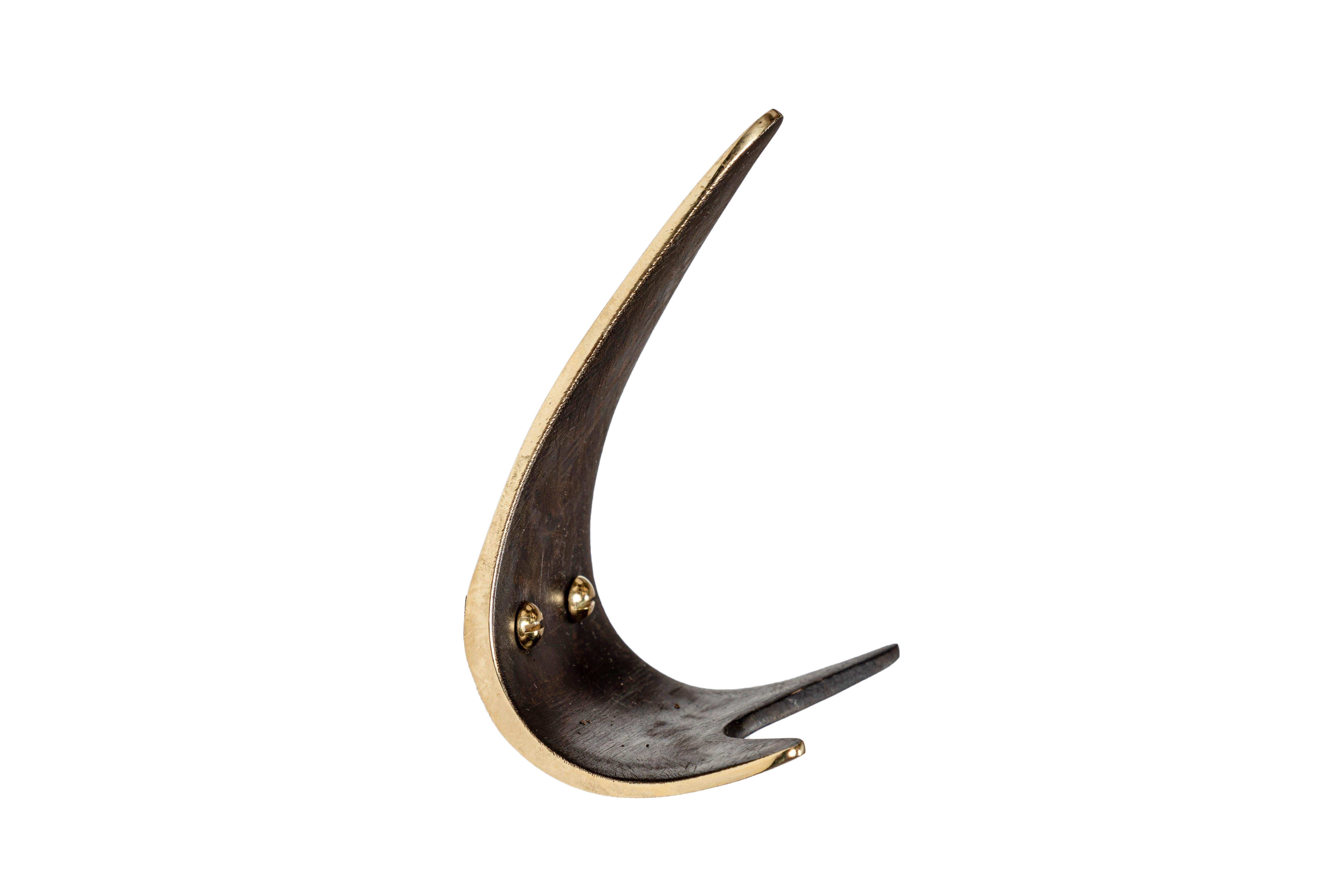 Carl Auböck brass #5439 patinated brass hook. Designed in the 1950s, this versatile and Minimalist Viennese hook is executed in polished and patinated brass by Werkstätte Carl Auböck, Austria. 

Price is per item. Two in stock ready to ship.