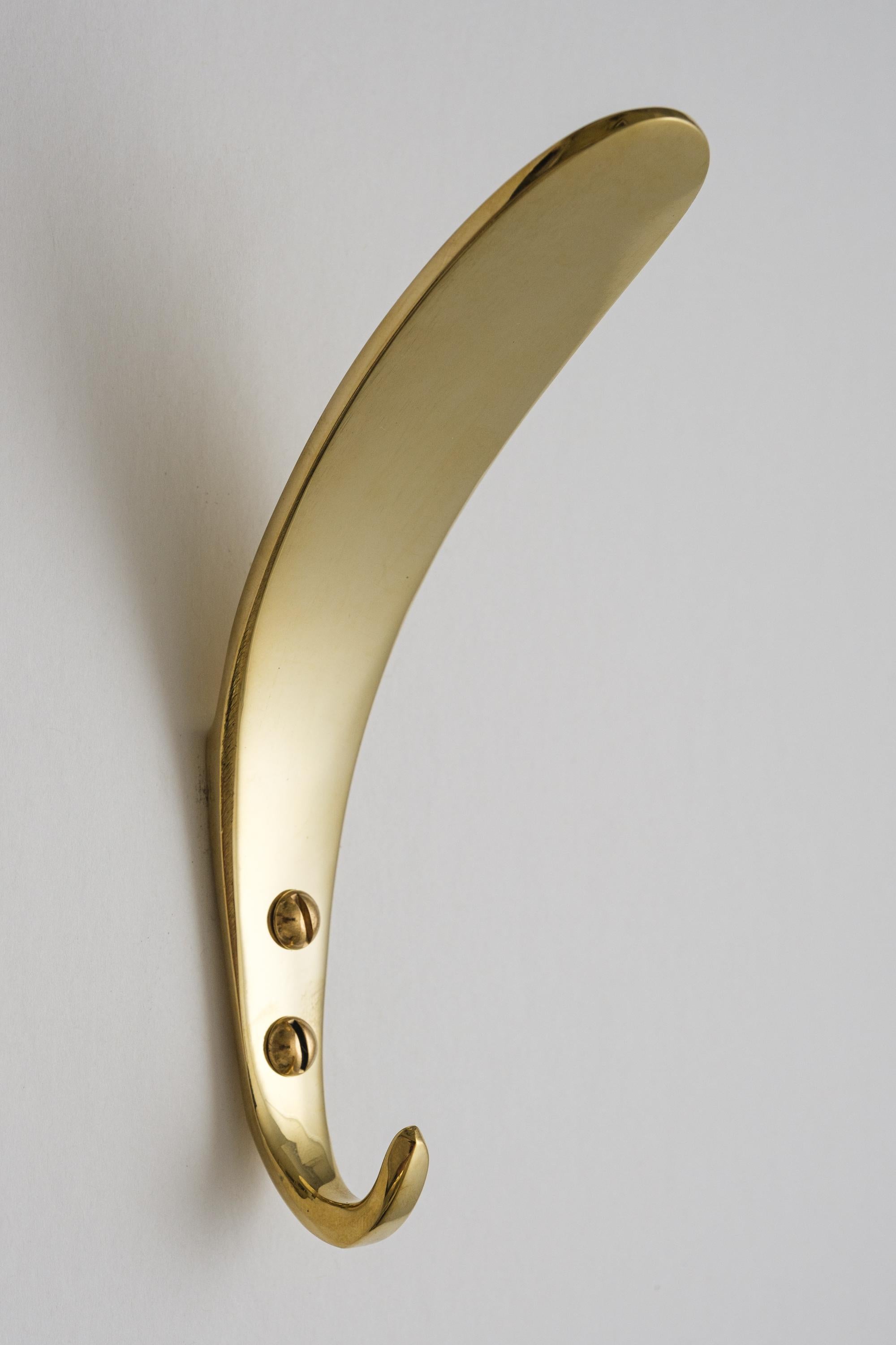 Carl Auböck Model #4327 polished brass hook. Designed in the 1950s, this versatile and minimalist Viennese hook is executed in polished brass by Werkstätte Carl Auböck, Austria.

Produced by Carl Auböck IV in the original Auböck workshop in the 7th