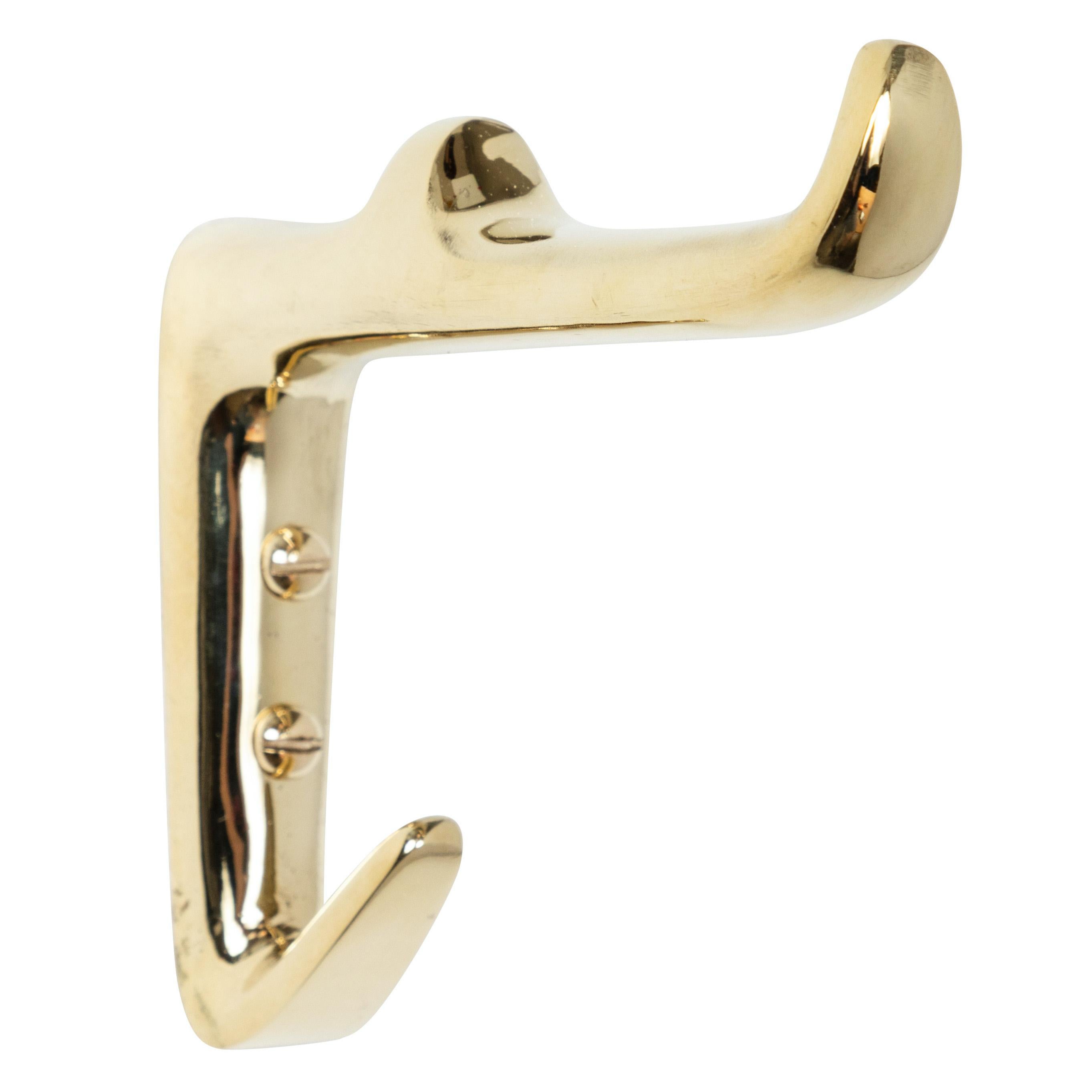 Carl Auböck brass #4956 brass hook. Designed in the 1950s, this versatile and Minimalist Viennese hook is executed in polished brass by Werkstätte Carl Auböck, Austria.

Price is per item. Two in stock ready to ship. Available in unlimited