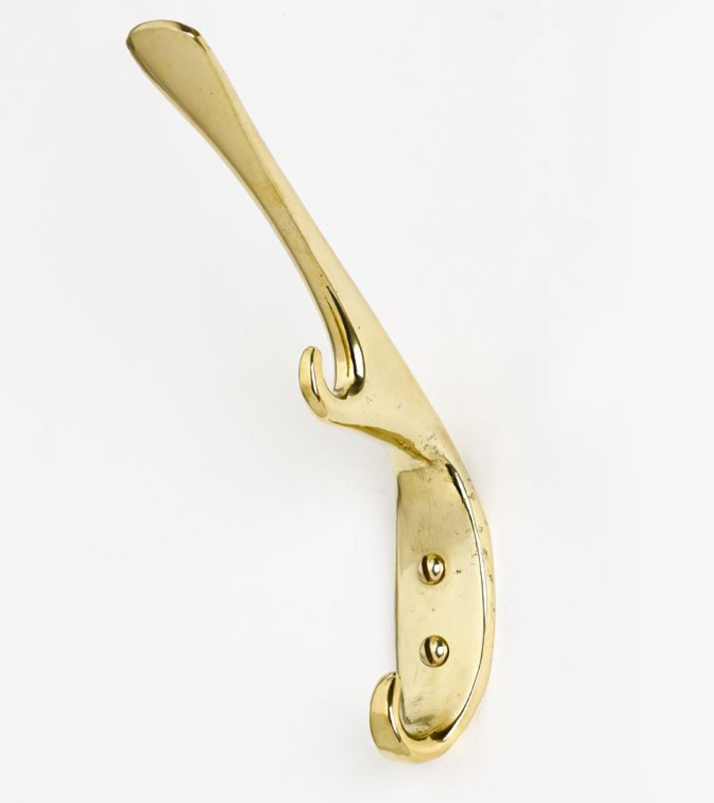 Carl Auböck brass #5439 brass hook. Designed in the 1950s, this versatile and Minimalist Viennese candleholder is executed in polished brass by Werkstätte Carl Auböck, Austria.

Price is per item. Two in stock ready to ship. Available in unlimited