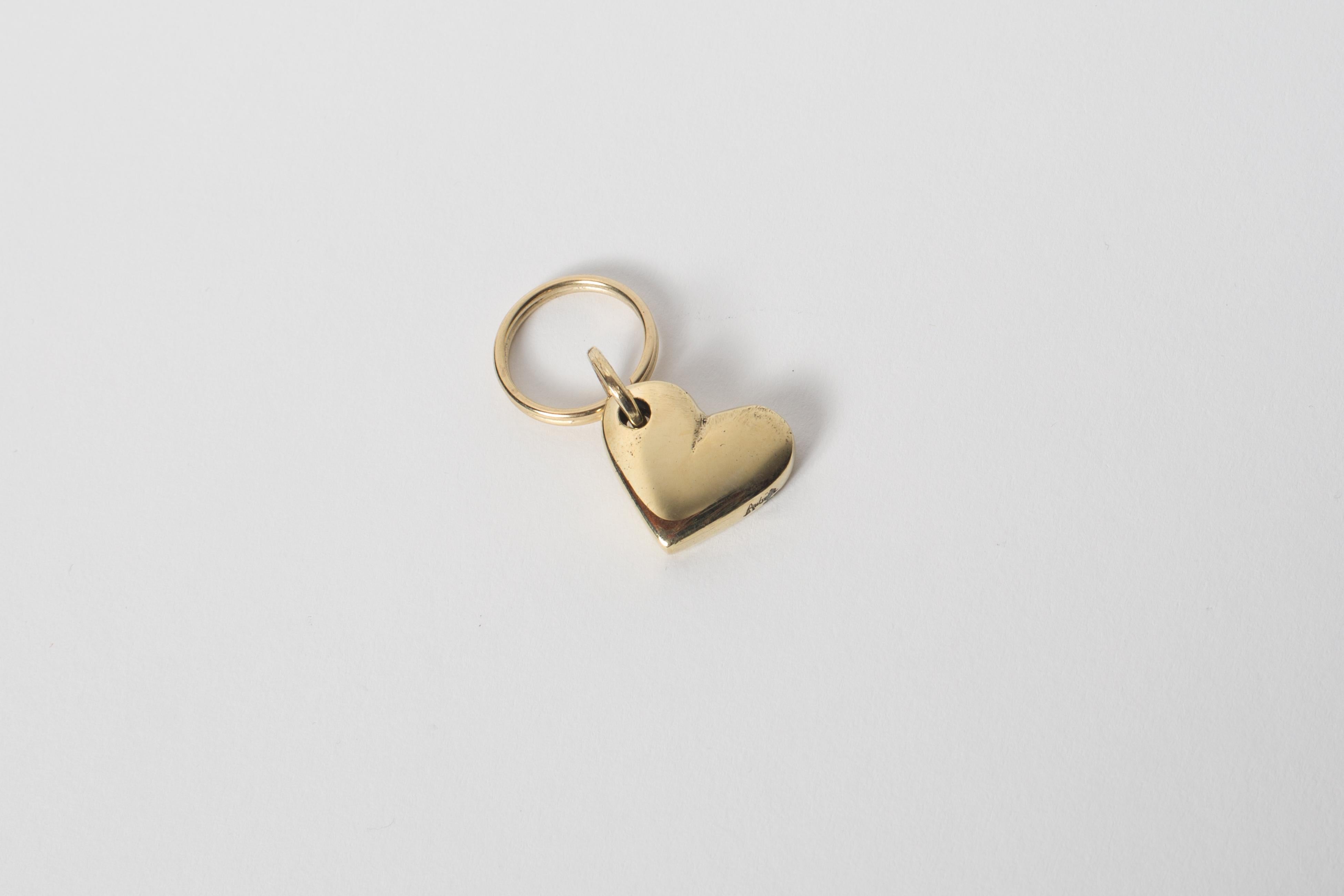 Carl Aubo¨ck Model #5600 'Heart' Solid Brass Keyring w/ Signature. Designed in the 1950s, this incredibly refined and sculptural object is hand fabricated in polished brass. 

Price is per item. One in stock ready to ship. Available in unlimited