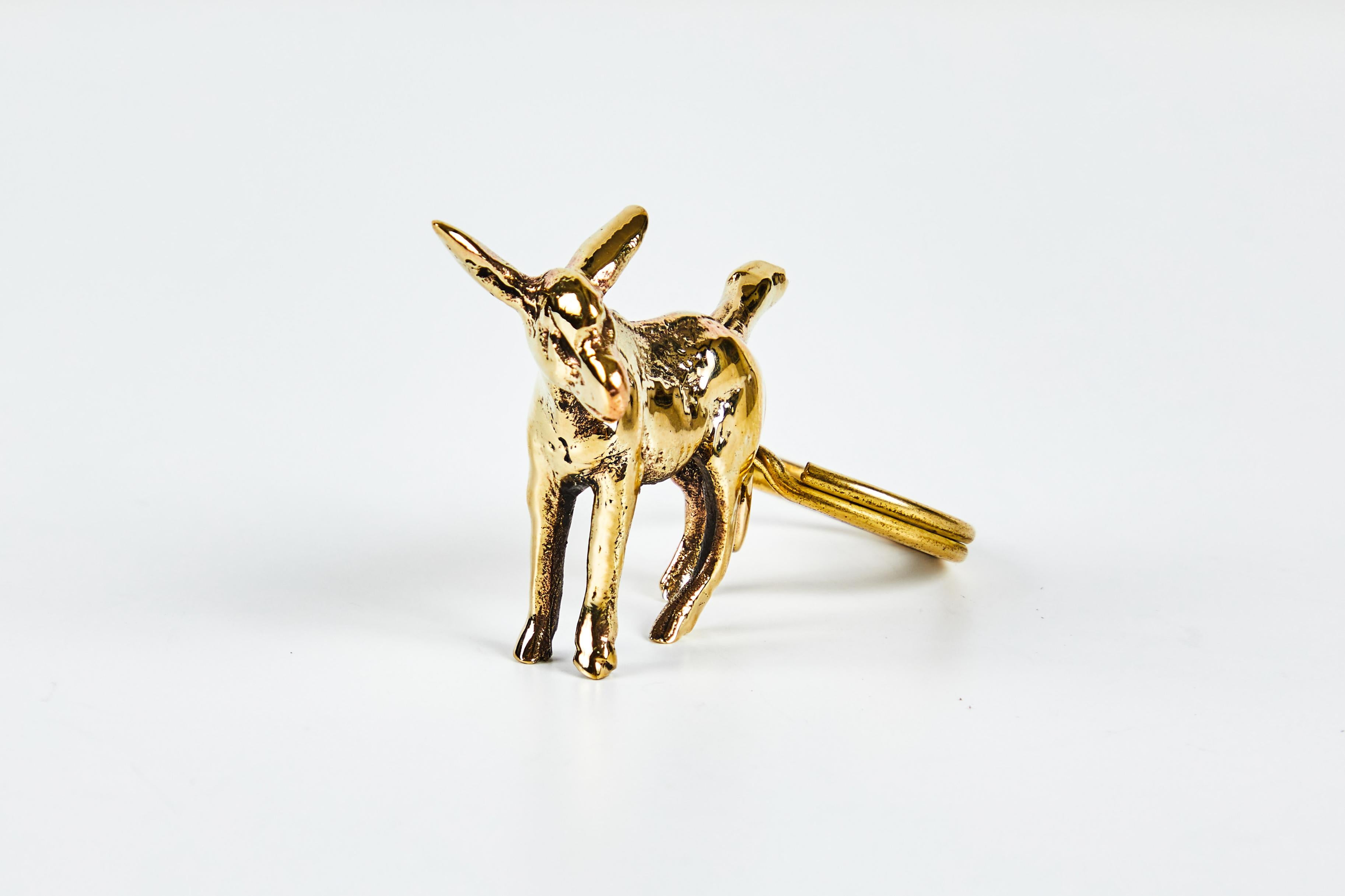 Carl Auböck model #5608 'Donkey' brass figurine keyring. Designed in the 1950s, this incredibly refined and sculptural object is hand fabricated in polished brass. 

Price is per item. One in stock ready to ship. Available in unlimited quantities.