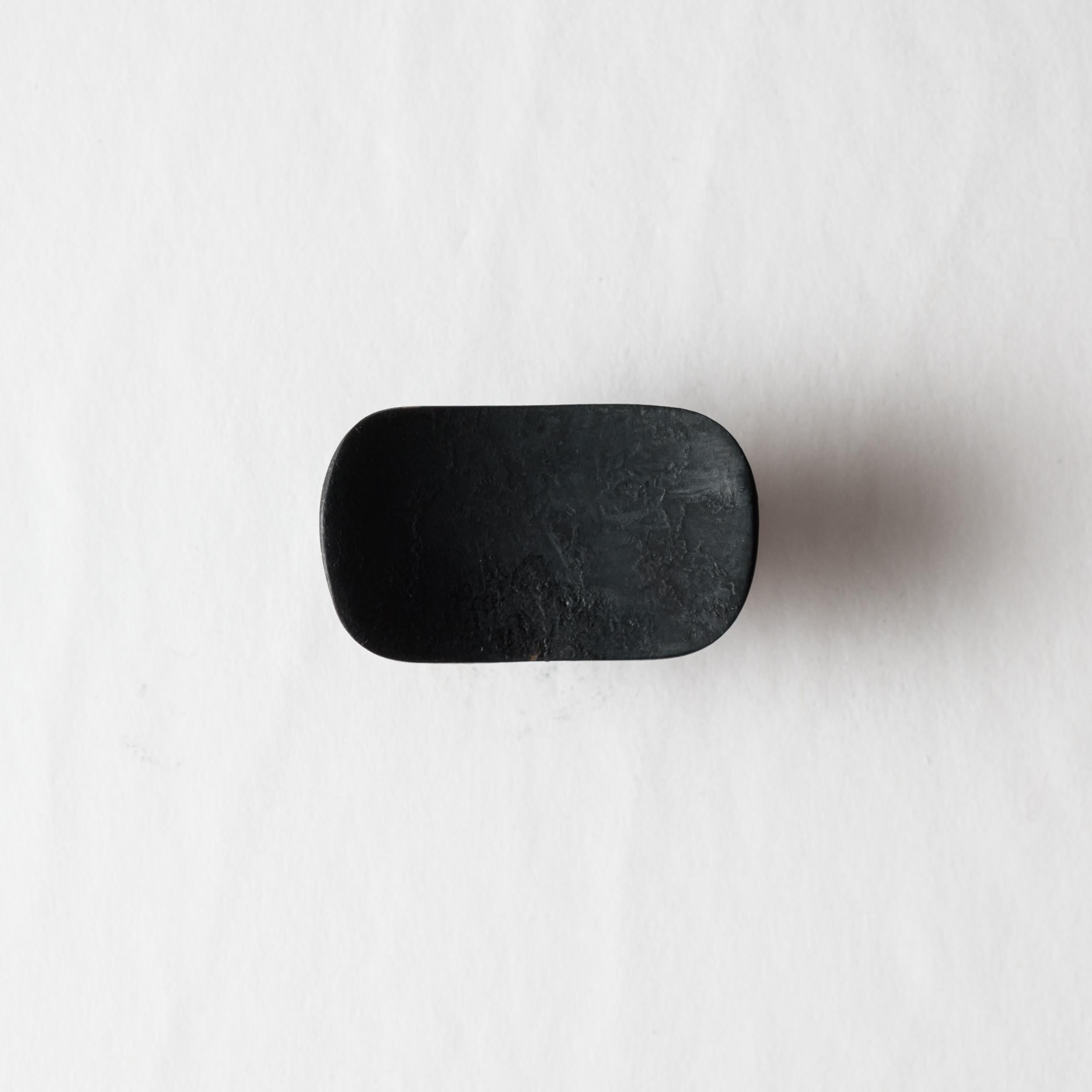 Carl Auböck Model #9038 patinated brass knob.

Designed in the 1950s, this versatile and Minimalist Viennese knob is executed in darkly patinated brass by Werkstätte Carl Auböck, Austria. Its minimalist design combines clean form with