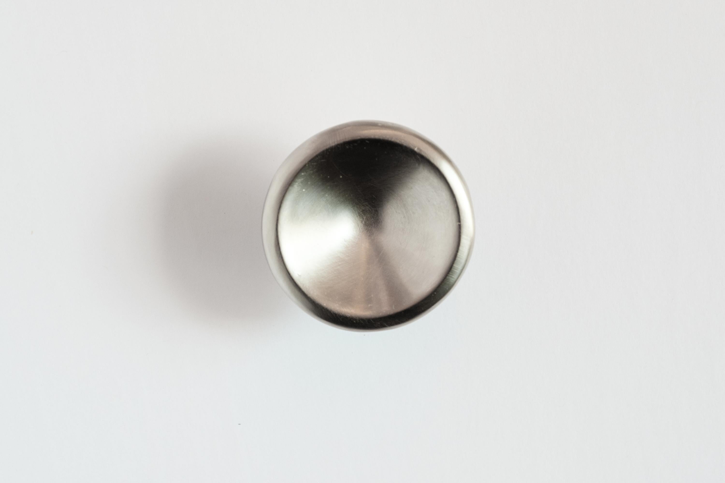Carl Auböck model #8040-2 knob in nickel.

Designed in the 1950s, this versatile and Minimalist Viennese knob is executed in brushed nickel by Werkstätte Carl Auböck, Austria. Its minimalist design combines clean form with functionality.

Produced