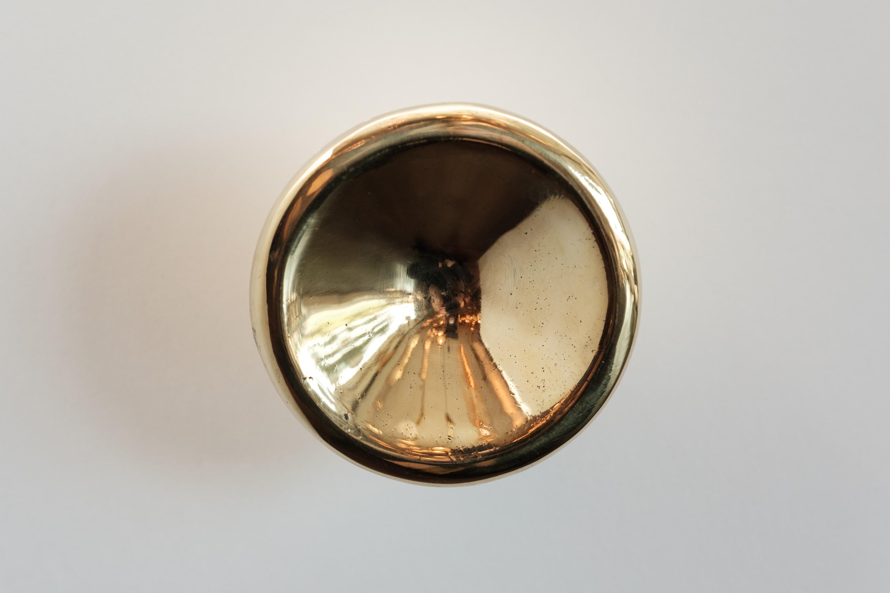 Carl Auböck Model #8040-2 polished brass knob.

Designed in the 1950s, this versatile and Minimalist Viennese knob is executed in polished brass by Werkstätte Carl Auböck, Austria. Its minimalist design combines clean form with