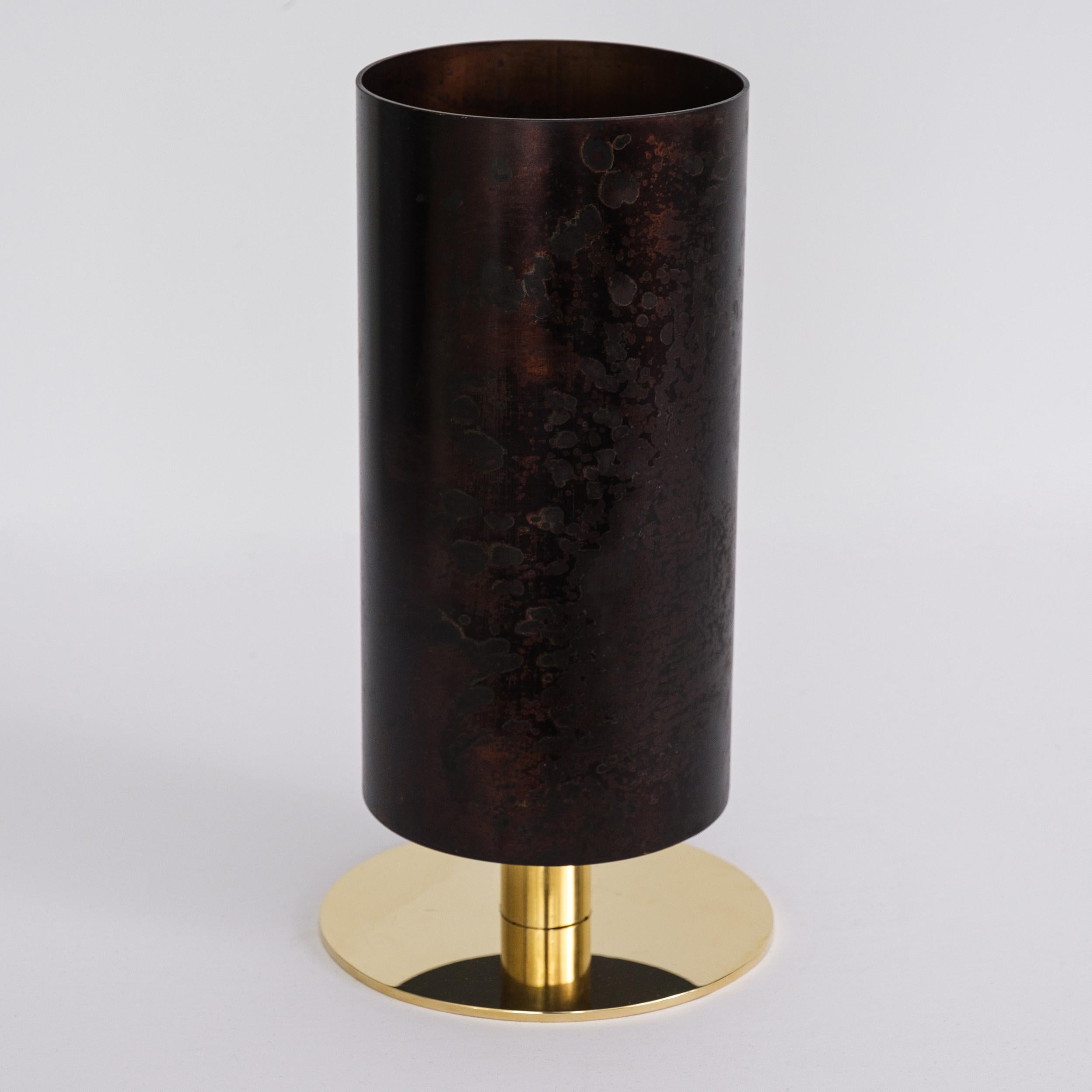 Carl Auböck Model #7247-6 patinated brass vase. Designed in the 1950s, this incredibly refined and sculptural Viennese vase is executed in polished and darkly patinated brass by Werkstätte Carl Auböck, Austria. 

Price is per item. Available in