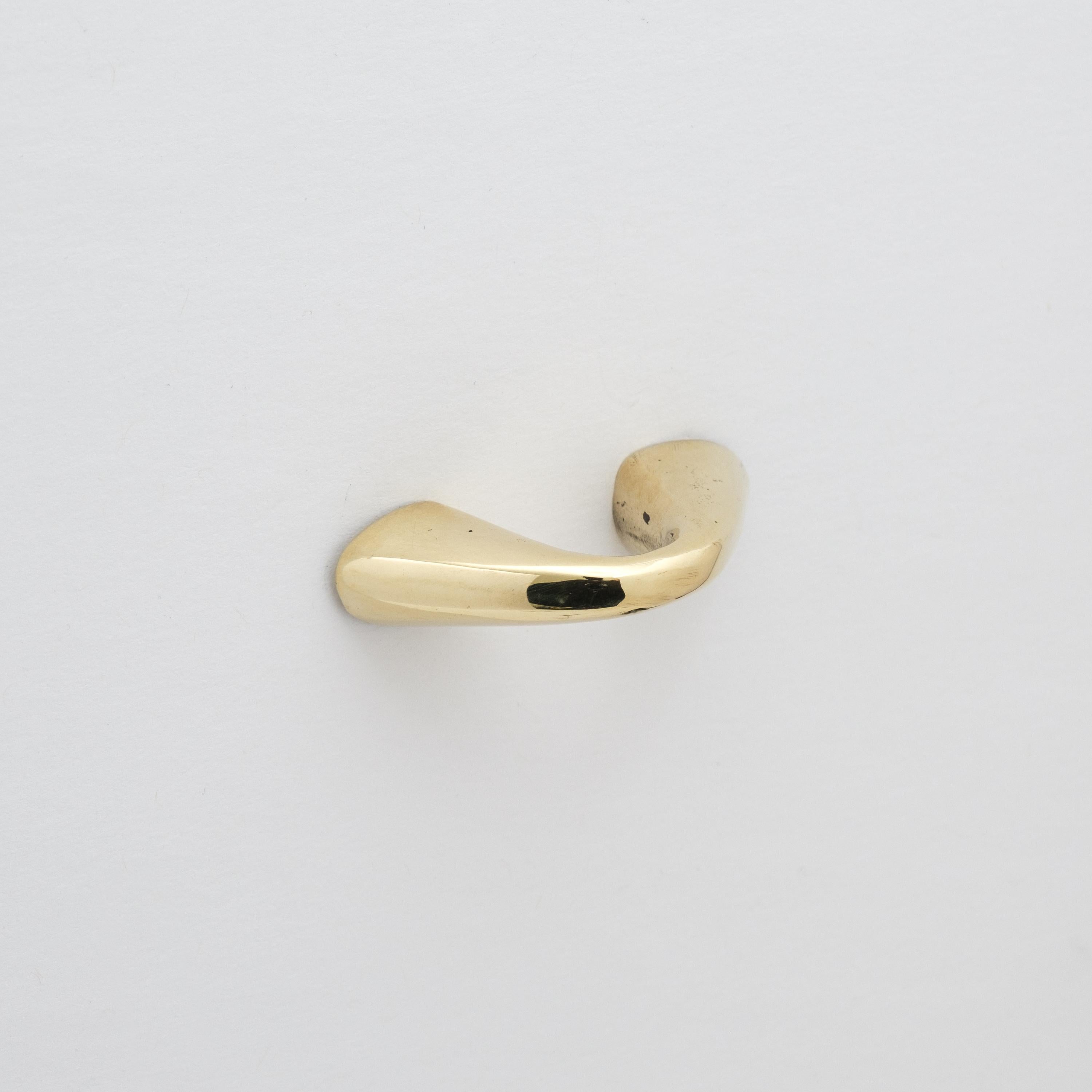 Carl Auböck Model #9031-1 polished brass drawer pull.

Designed in the 1950s, this versatile and Minimalist Viennese drawer pull is executed in polished brass by Werkstätte Carl Auböck, Austria. Its minimalist design combines clean form with