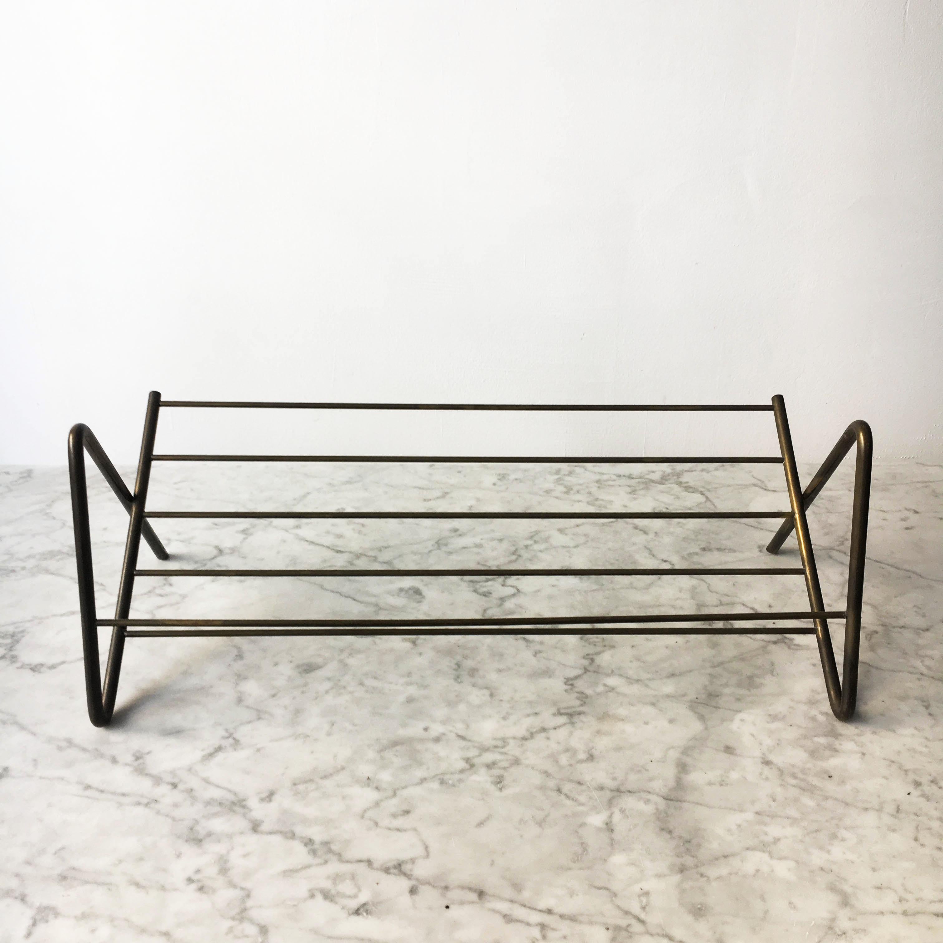 A very rare, one of a kind modernist brass book stand, designed and executed by Carl Auböck, Austria, 1950s. One of the 