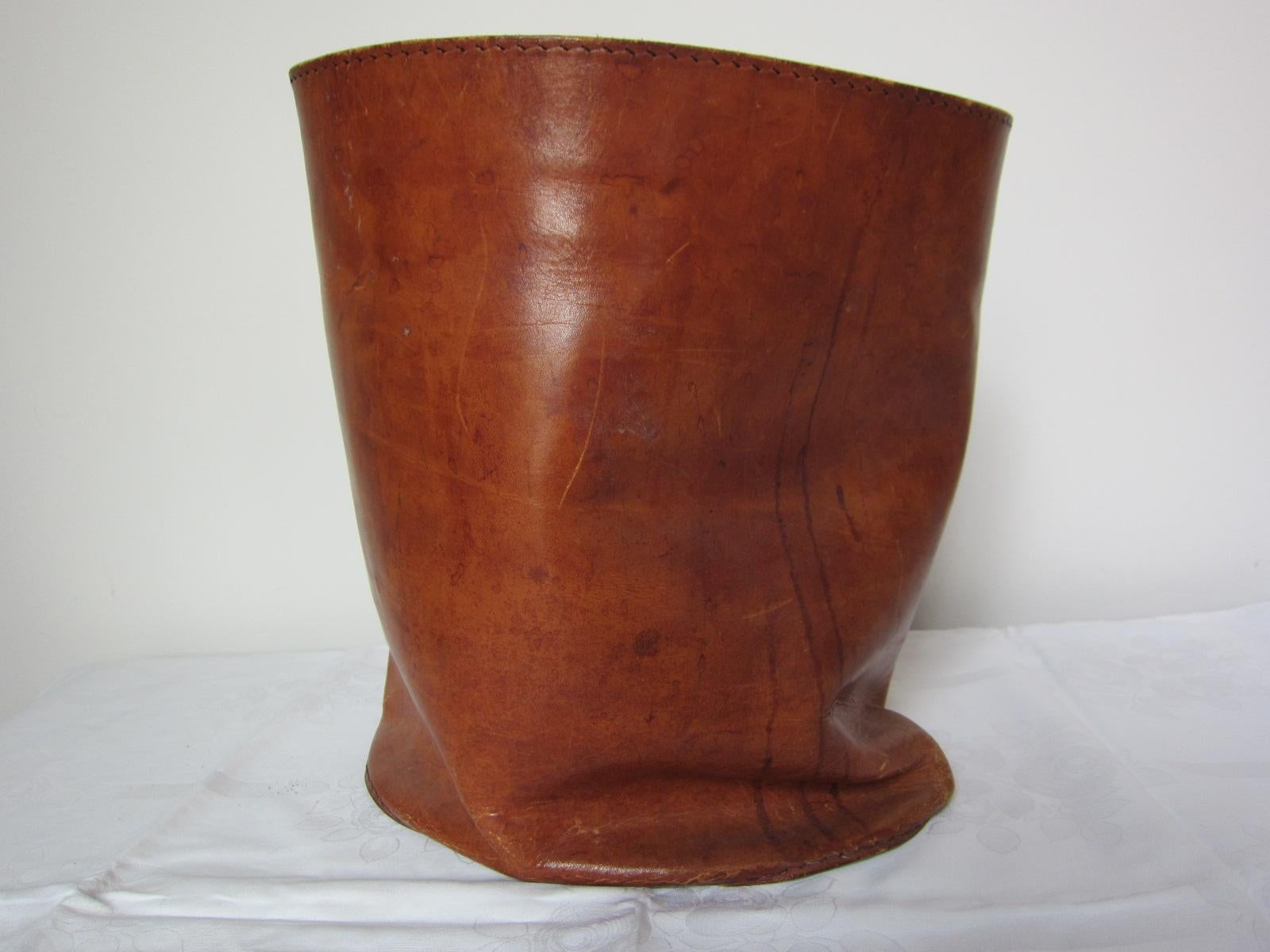 Beautiful patinaed leather basket.