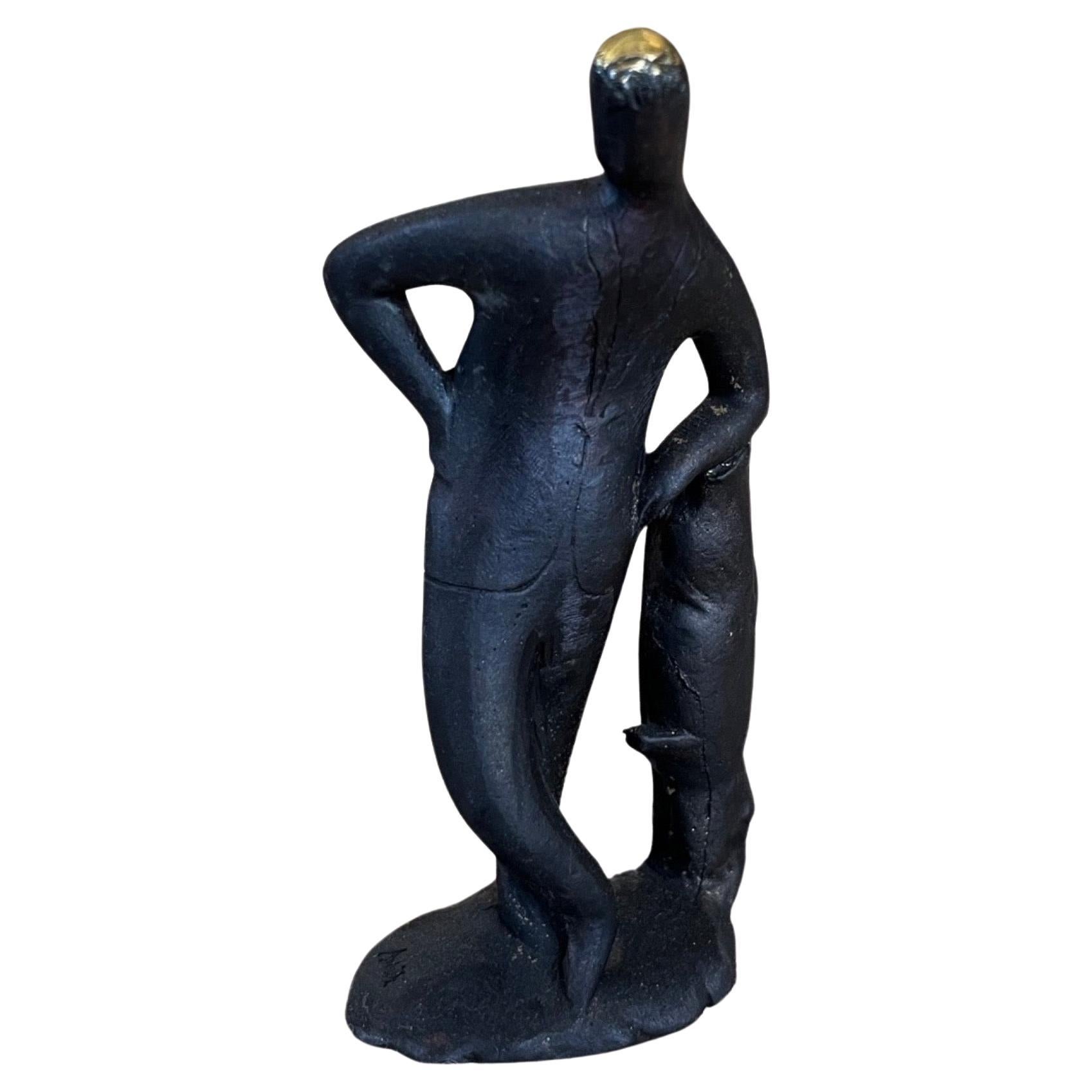 Carl Aubock Patinated Brass "Leaning on Tree Stump Figural Sculpture #4068 For Sale