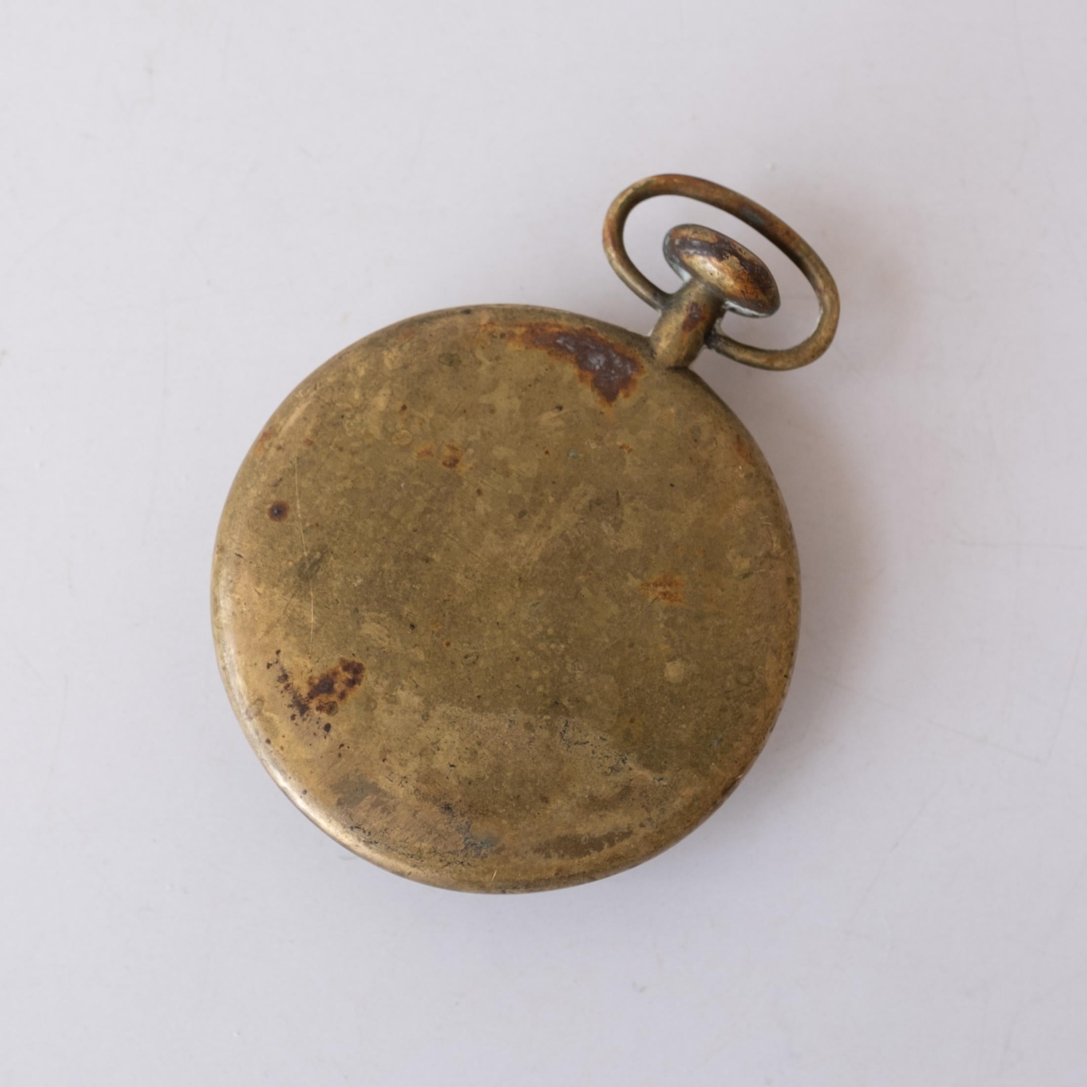 Solid bronze pocket watch shaped bottle opener and paperweight by Carl Aubock, Austria. 1960s. Signed. Great patina!